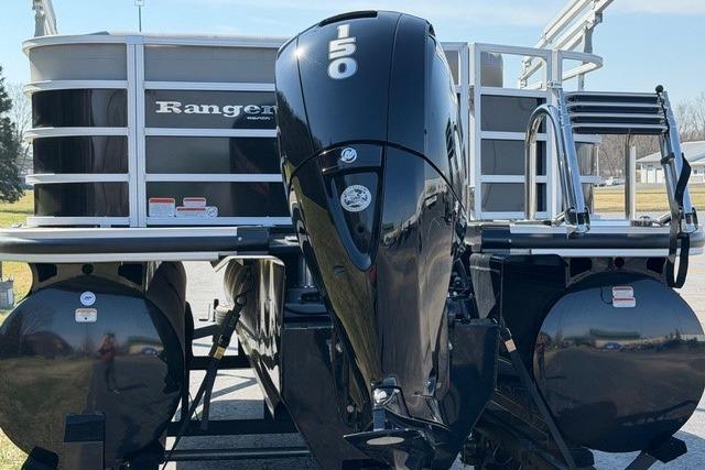 2025 Ranger Reata 223C pontoon boat with powerful 150 HP engine, rear view.