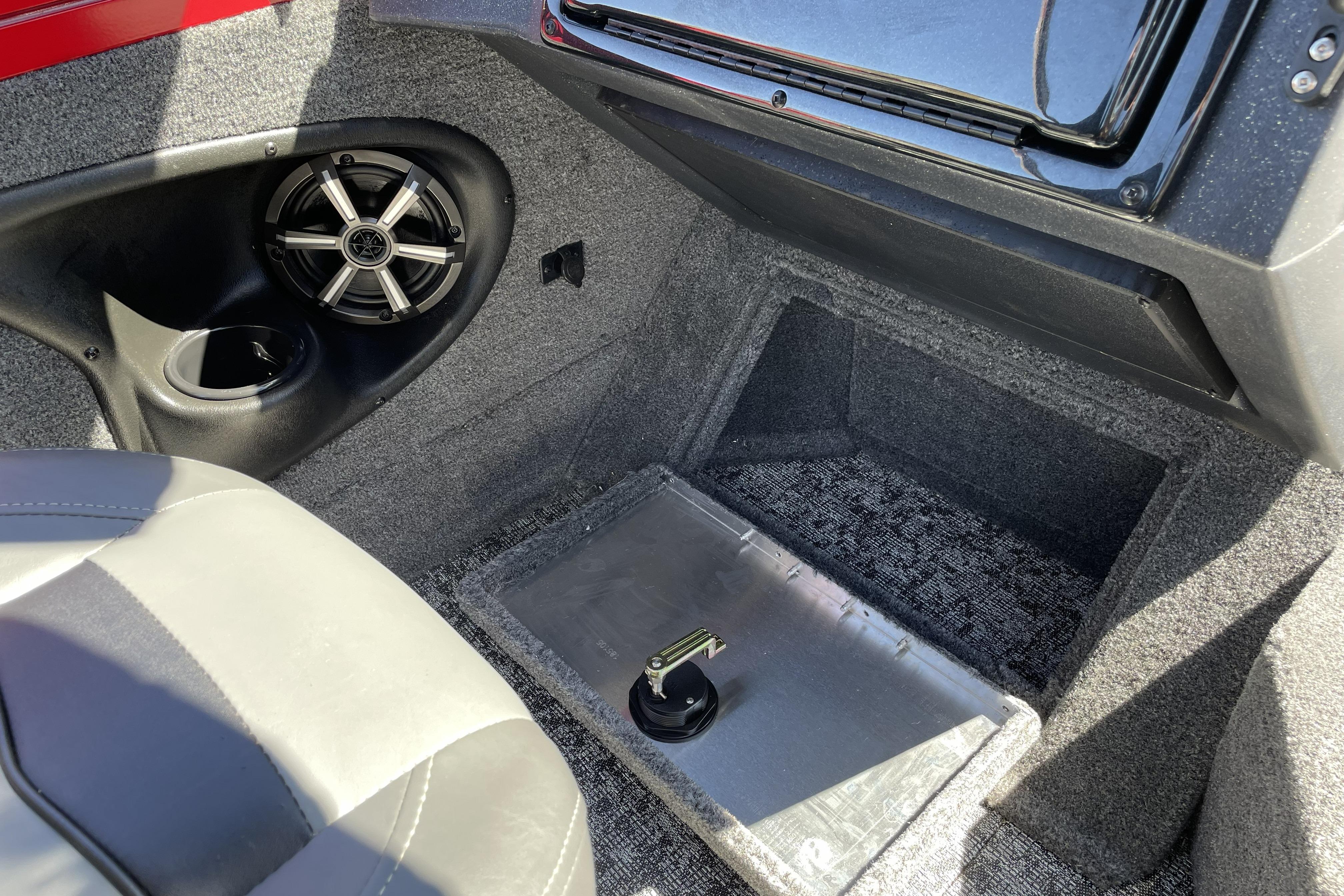 Interior of 2026 Tracker Targa V-18 WT boat with speaker and storage compartment.