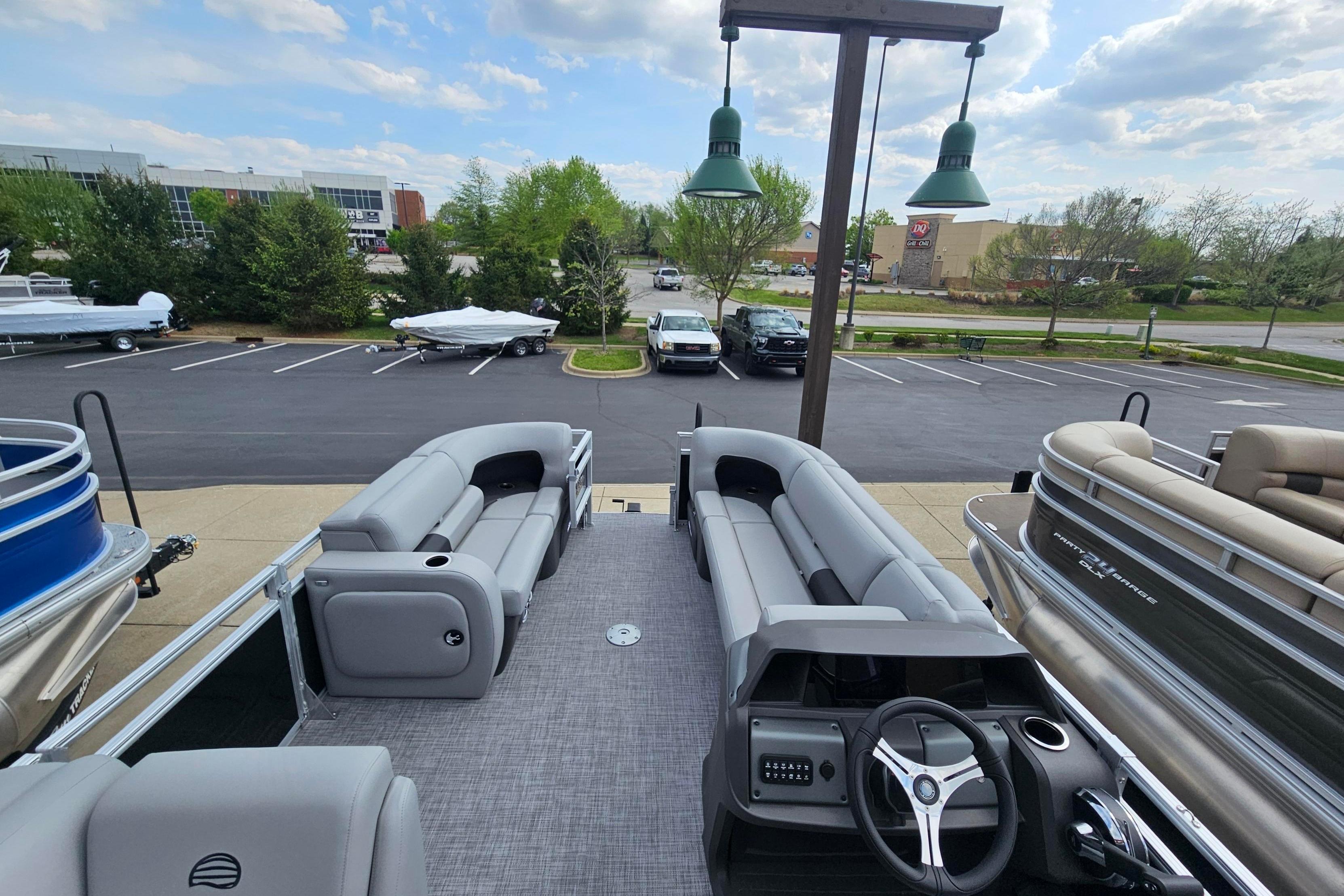 2026 Sun Tracker SportFish 22 DLX pontoon boat with spacious seating and modern design.