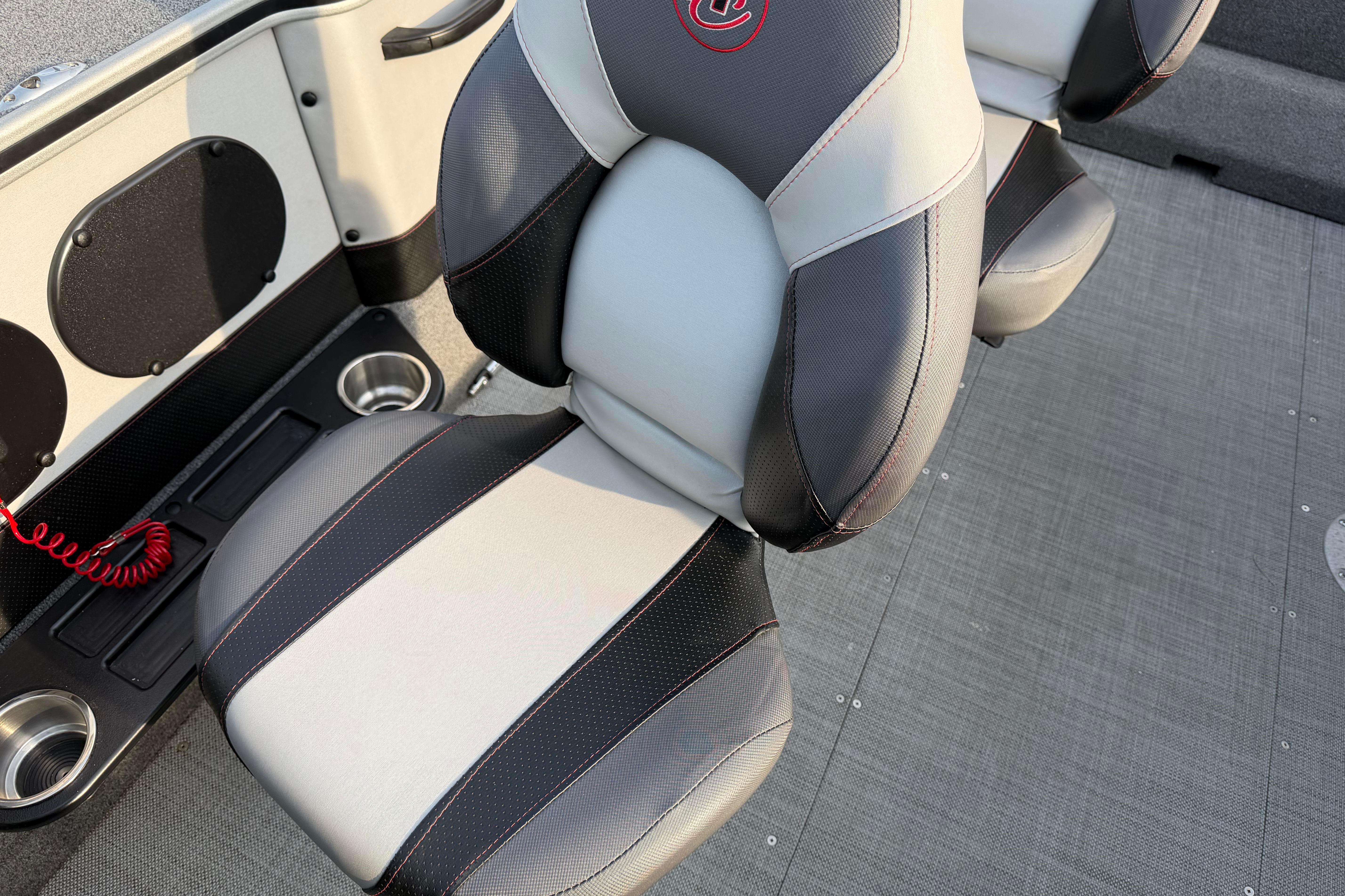 2019 Alumacraft Trophy 205 boat seat with cup holders and red safety cord.