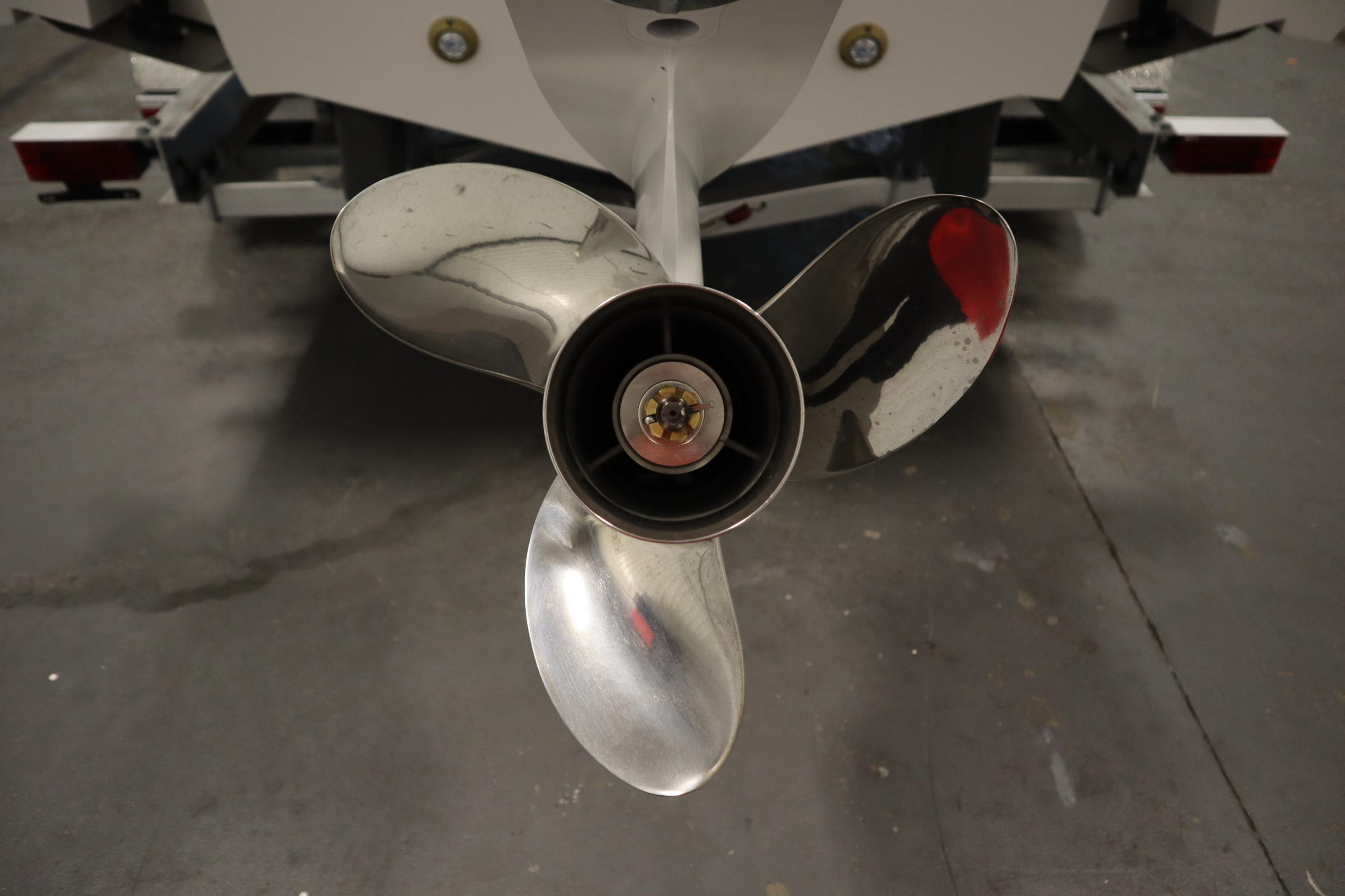 Close-up of a 2026 Sea Fox 228 Commander boat propeller in a garage setting.