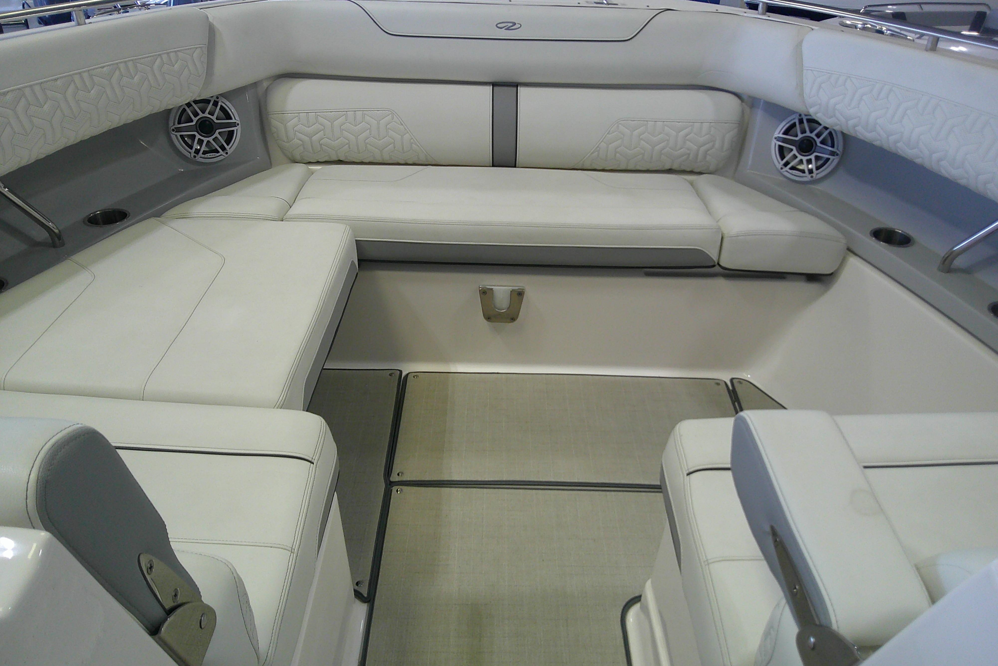Luxurious interior of 2023 Regal LX36 boat with plush seating and modern design.