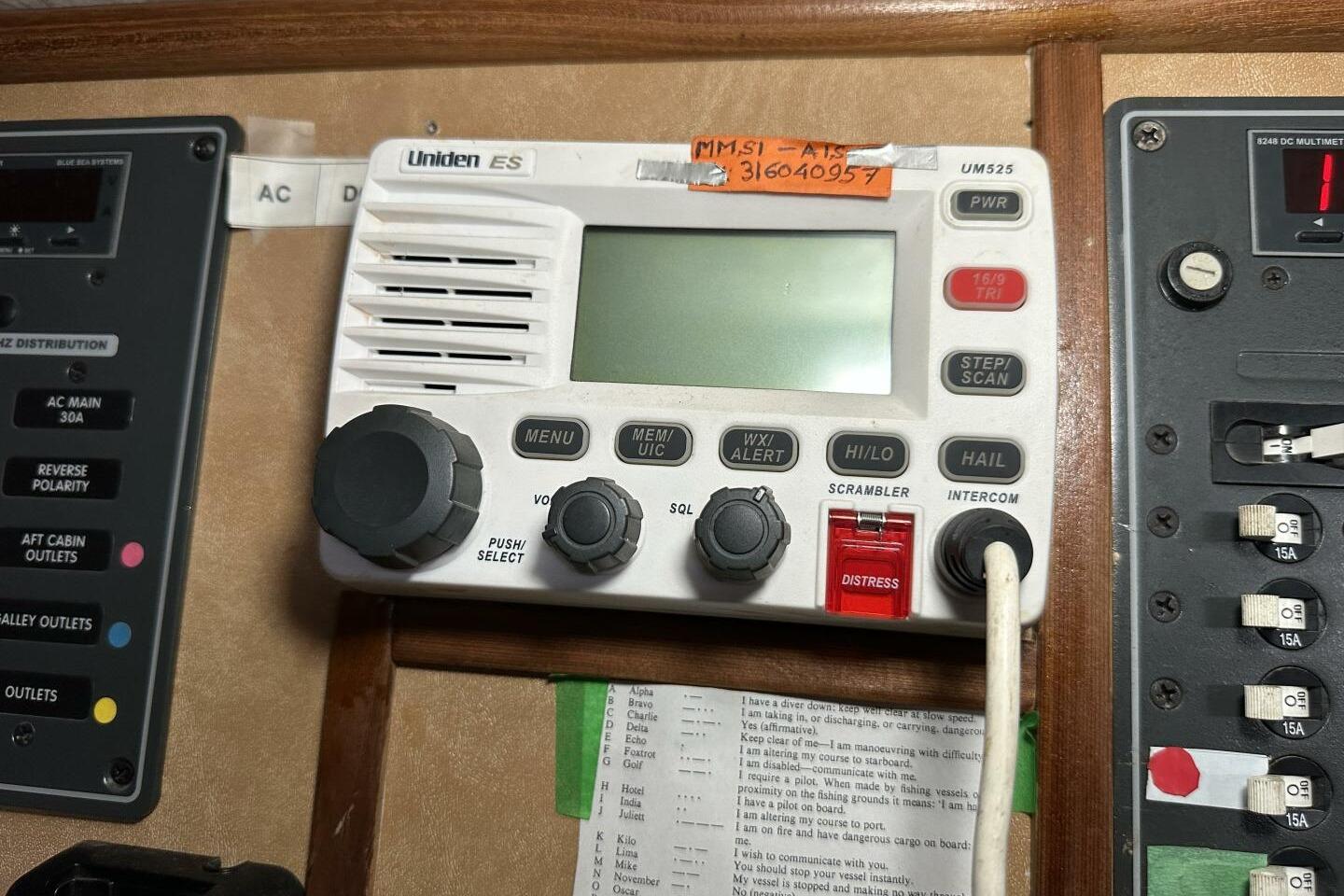 Radio control panel on a Hughes 3910, 1979 model, featuring Uniden ES device.