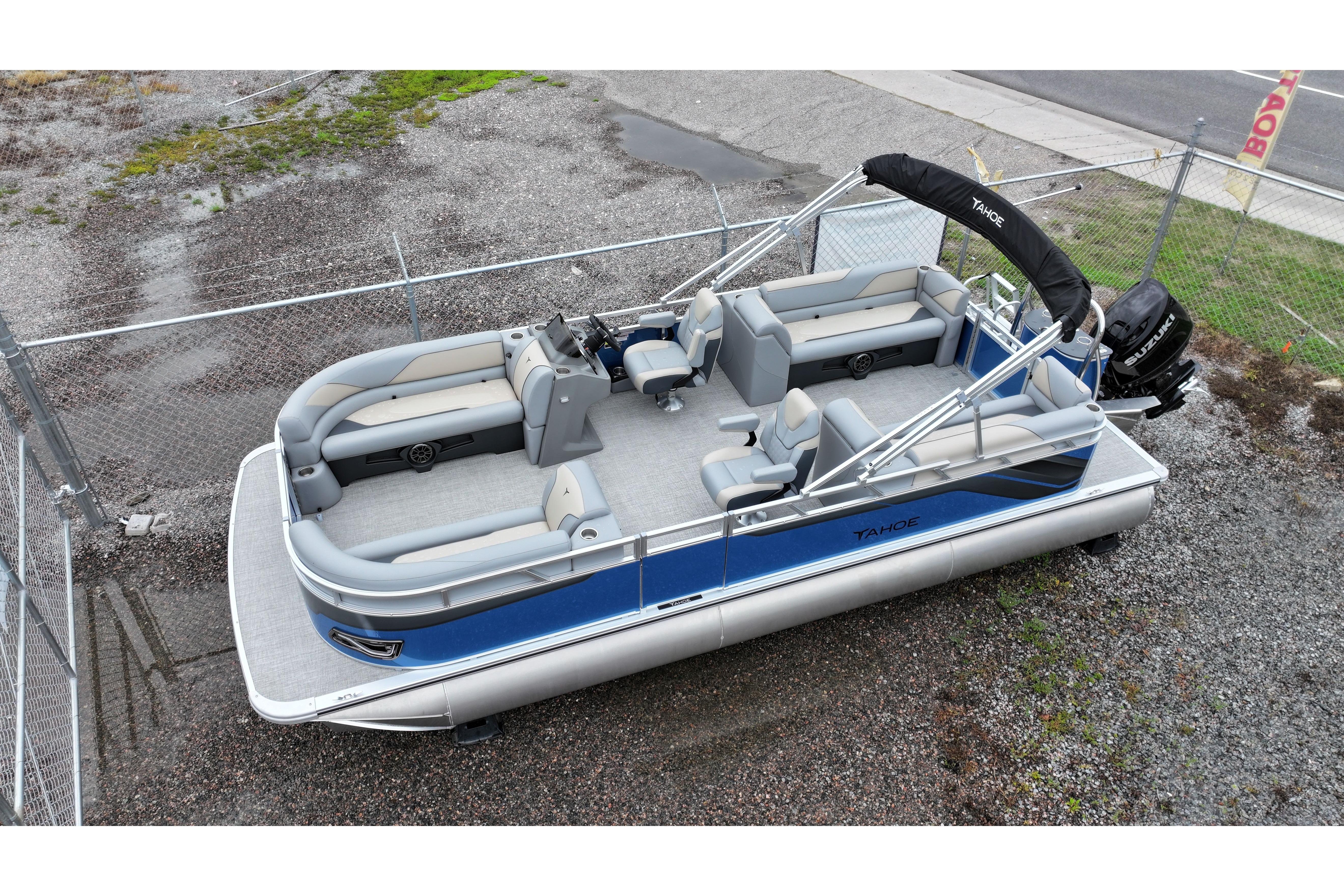 2026 Tahoe Pontoon Sport 85 Quad Lounger, blue and gray, parked on gravel.