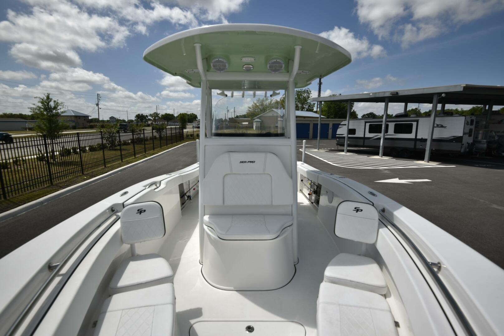 2023 Sea Pro 239 Deep V CC boat, center console, outdoor display, sunny day.
