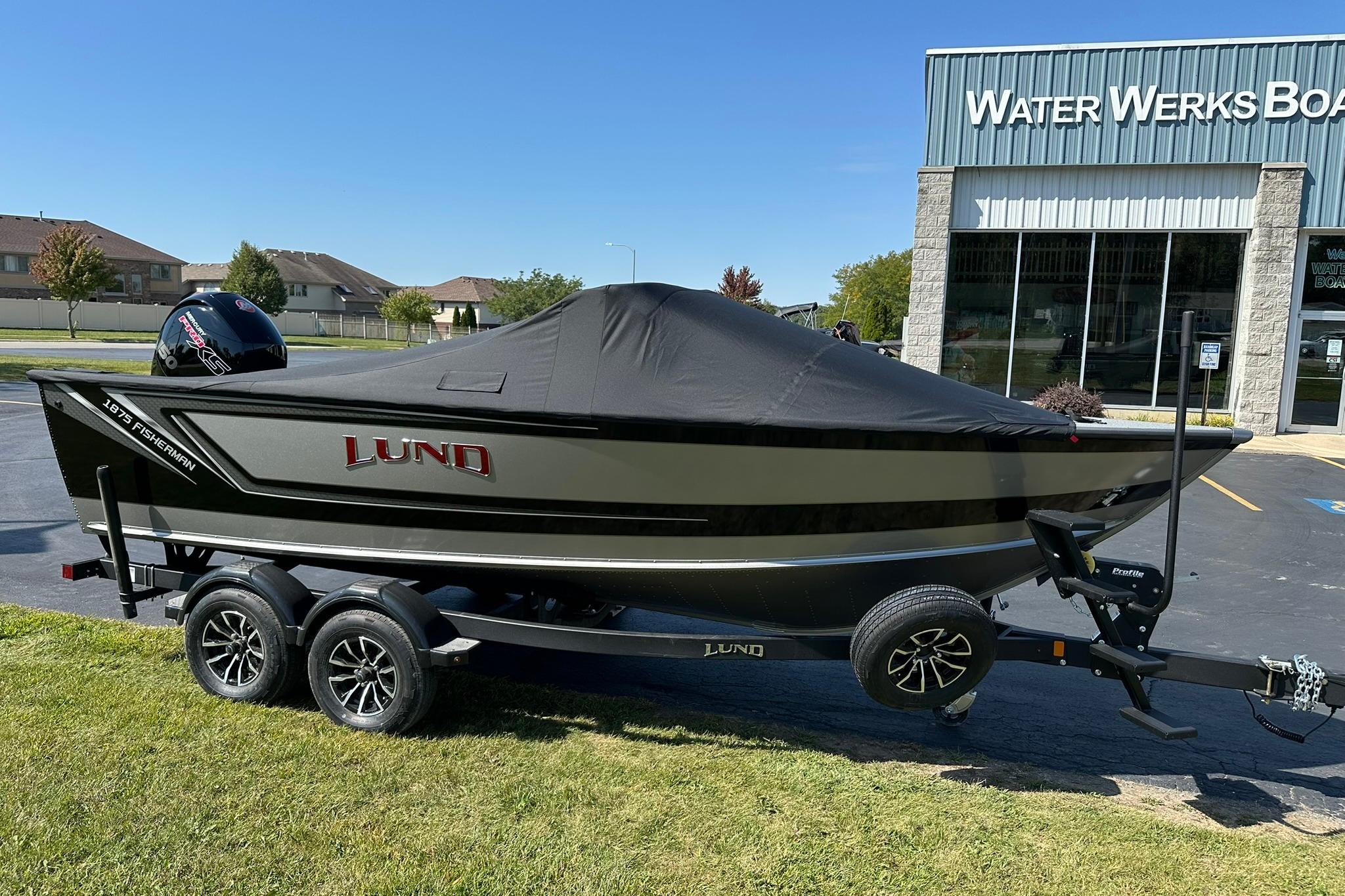 2026 Lund 1875 Fisherman boat on trailer outside Water Werks dealership.
