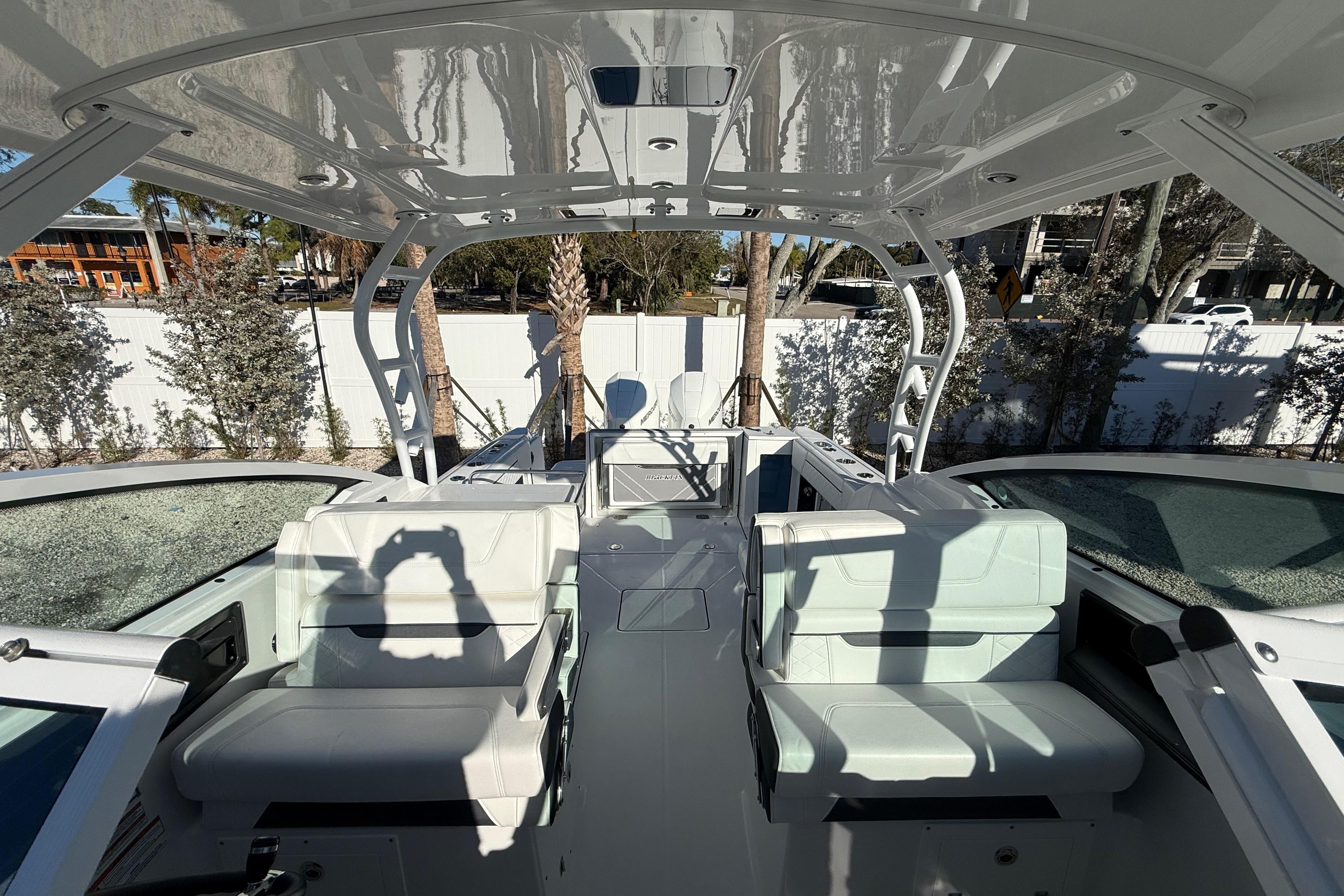 2022 Blackfin 272 DC boat interior with white seating and modern design.