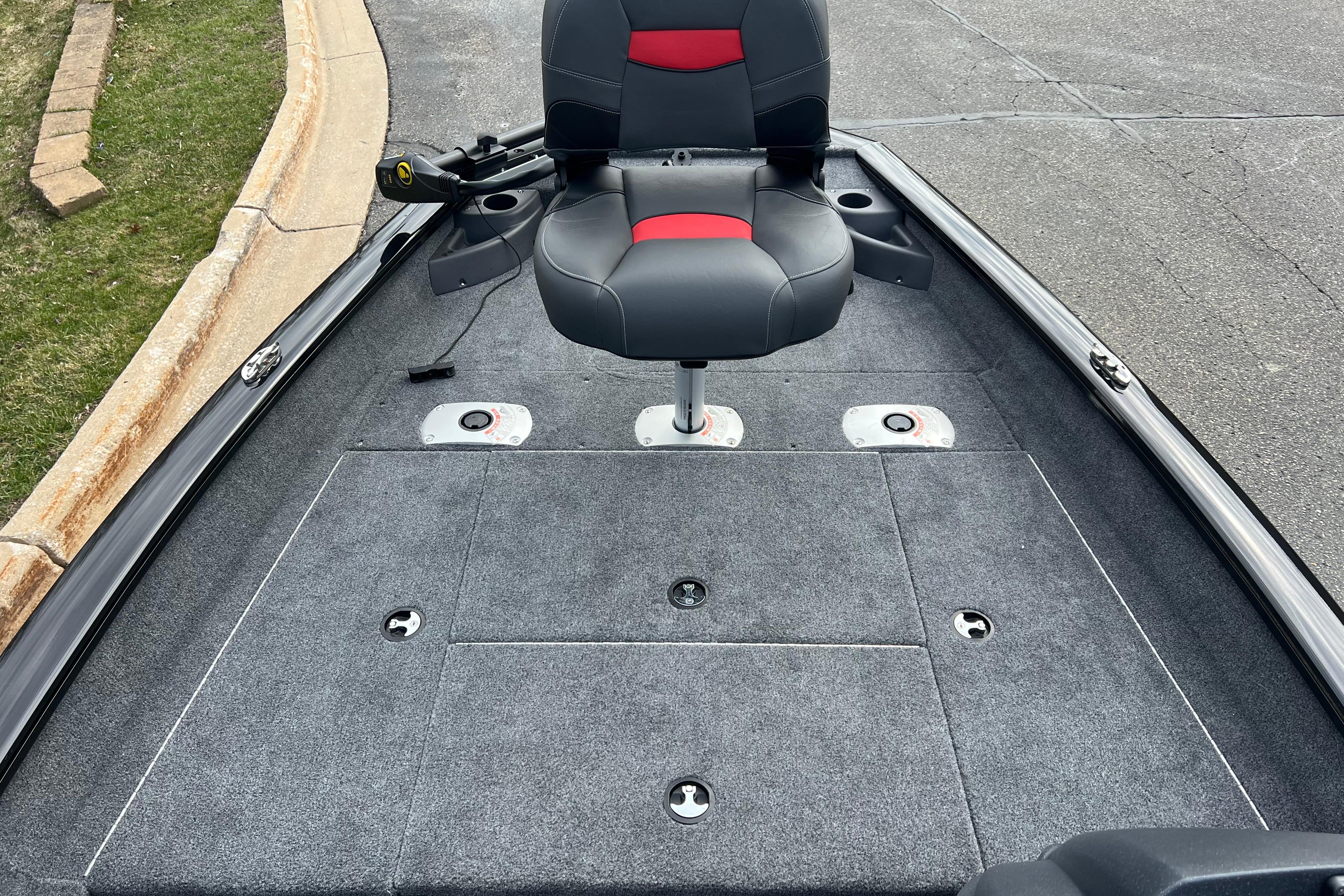 2026 Tracker Pro Team 175 Crappie Edition boat interior with swivel seat and carpeted deck.