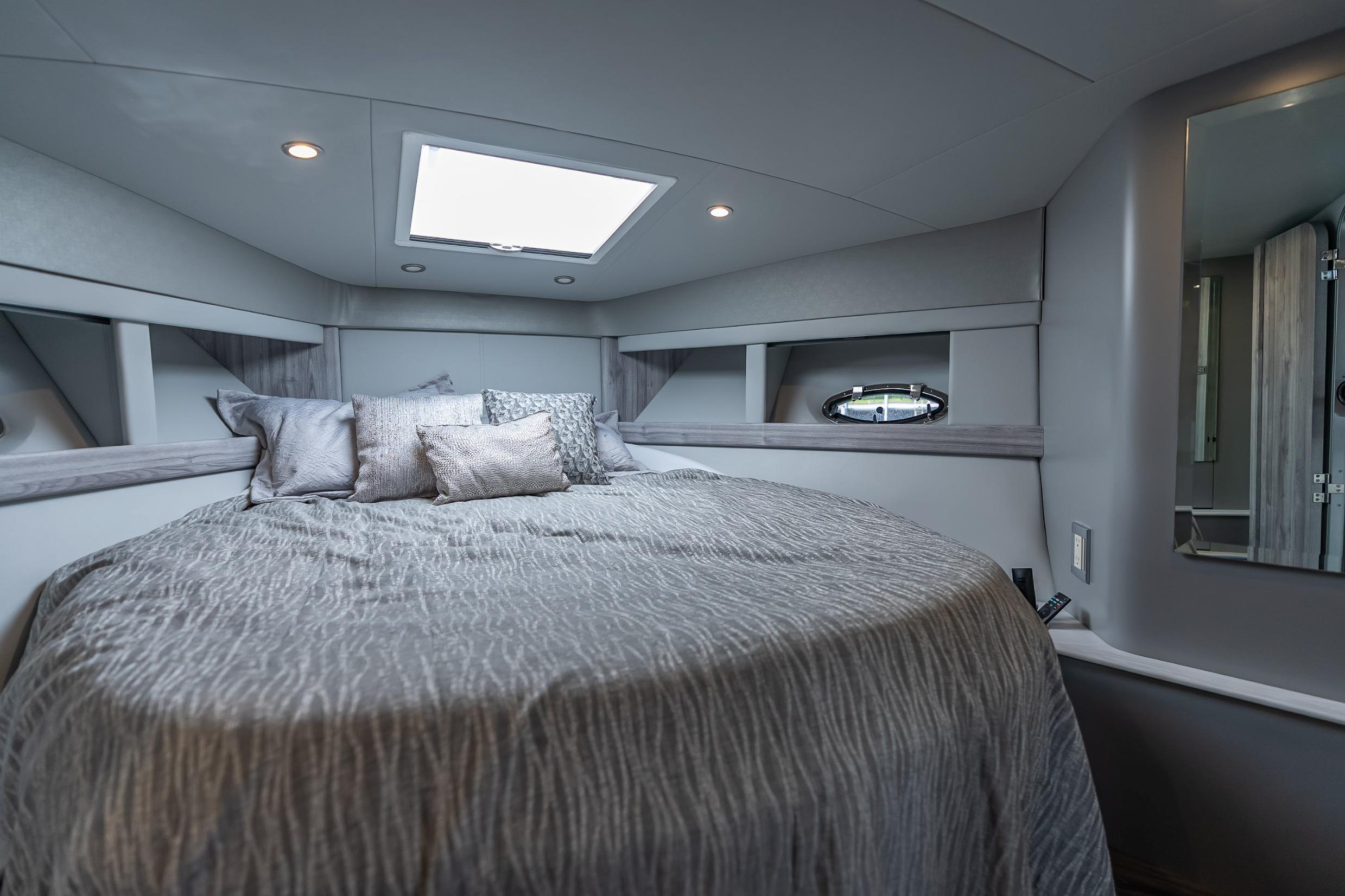 Luxurious interior of 2022 Formula 40 Performance Cruiser with elegant bedding and modern design.