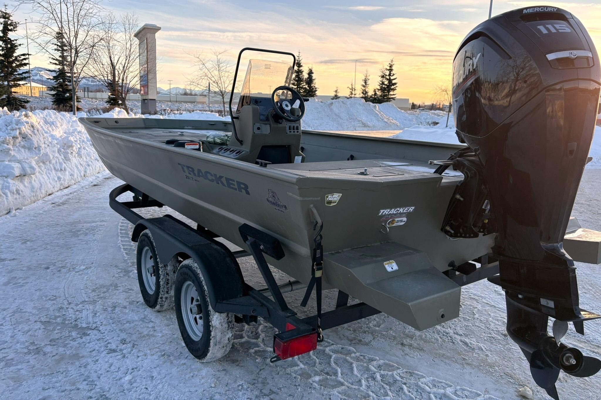 2024 Tracker Grizzly 2072 CC boat on snowy parking lot.
