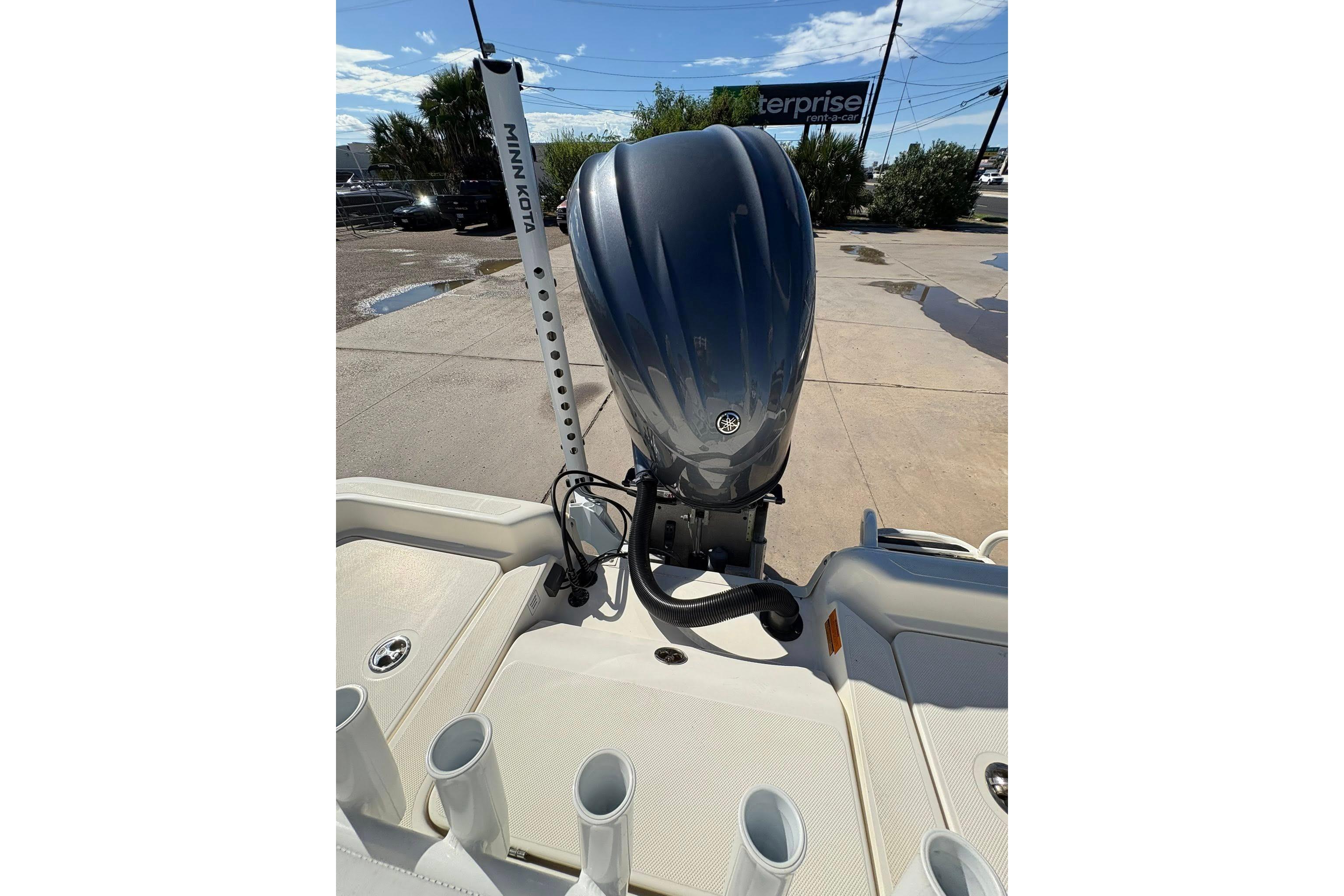 2023 Skeeter SX2550 Family boat with outboard motor and Minn Kota accessory.