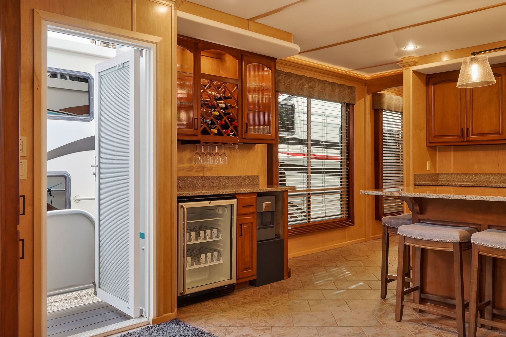 Interior of a 2010 Houseboat Throughbred with bar and wine cooler.