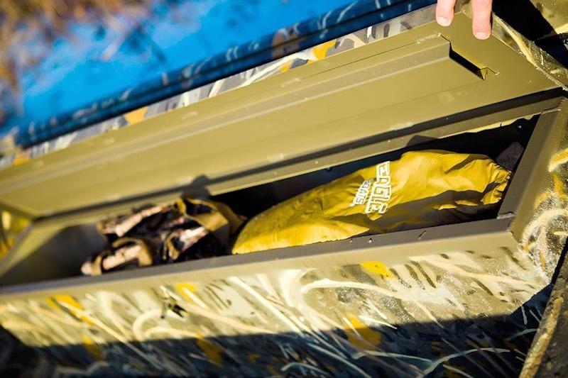 War Eagle 648LDV 2026 storage compartment with gear and camouflage design.
