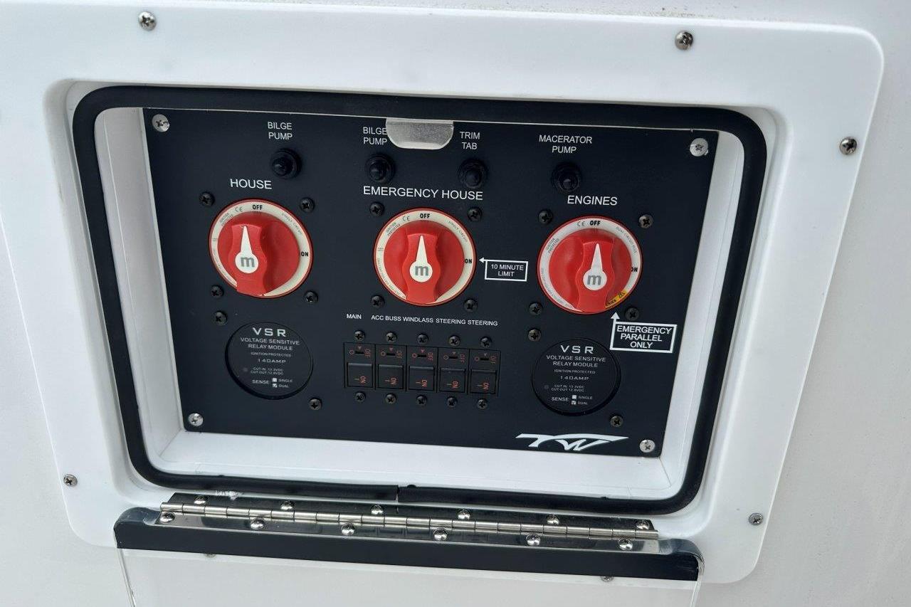 Control panel of 2026 Tidewater 272 LXF boat with emergency and engine switches.