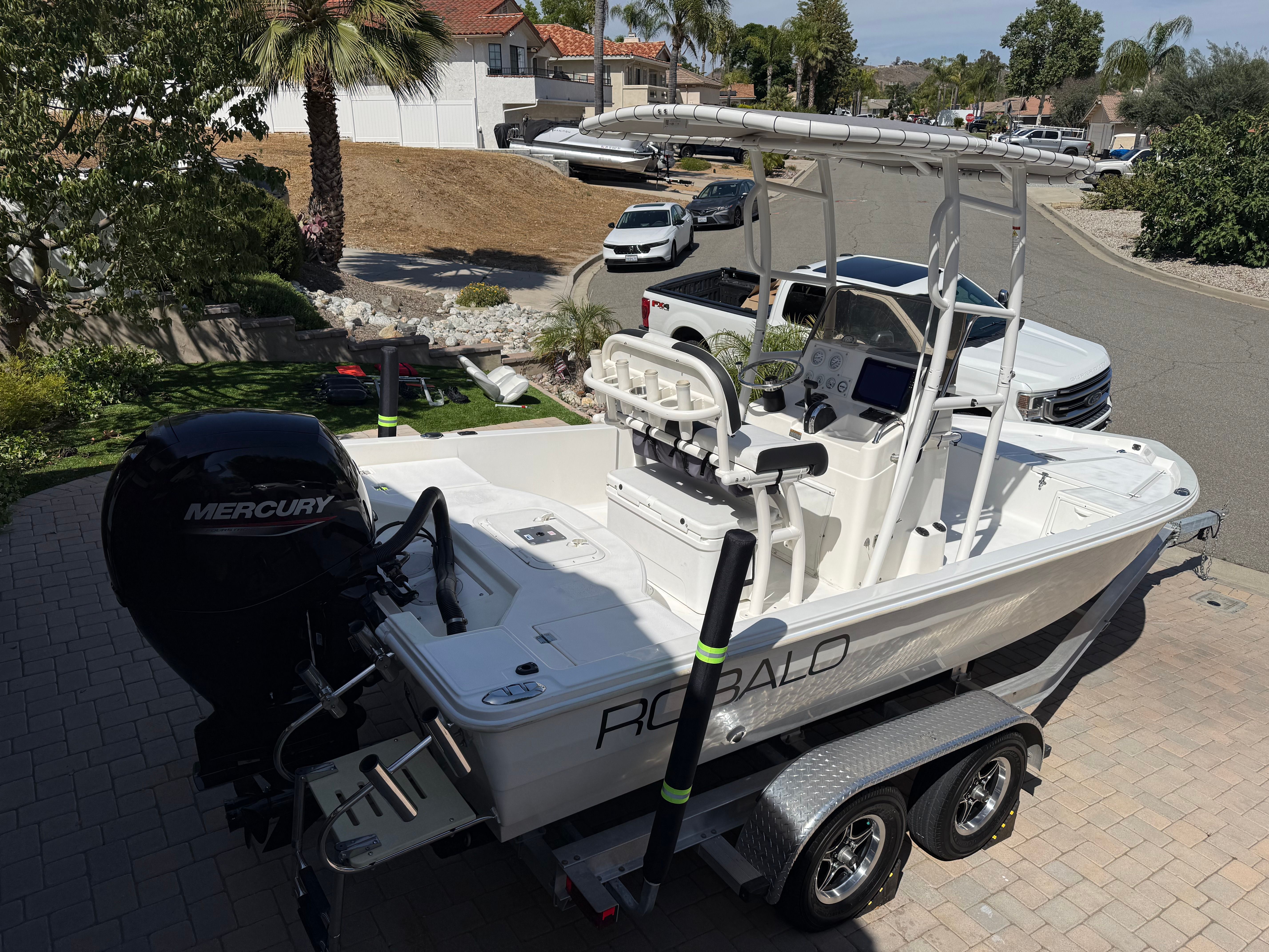 1998 Robalo 2100 Bay Hunter boat parked on trailer.