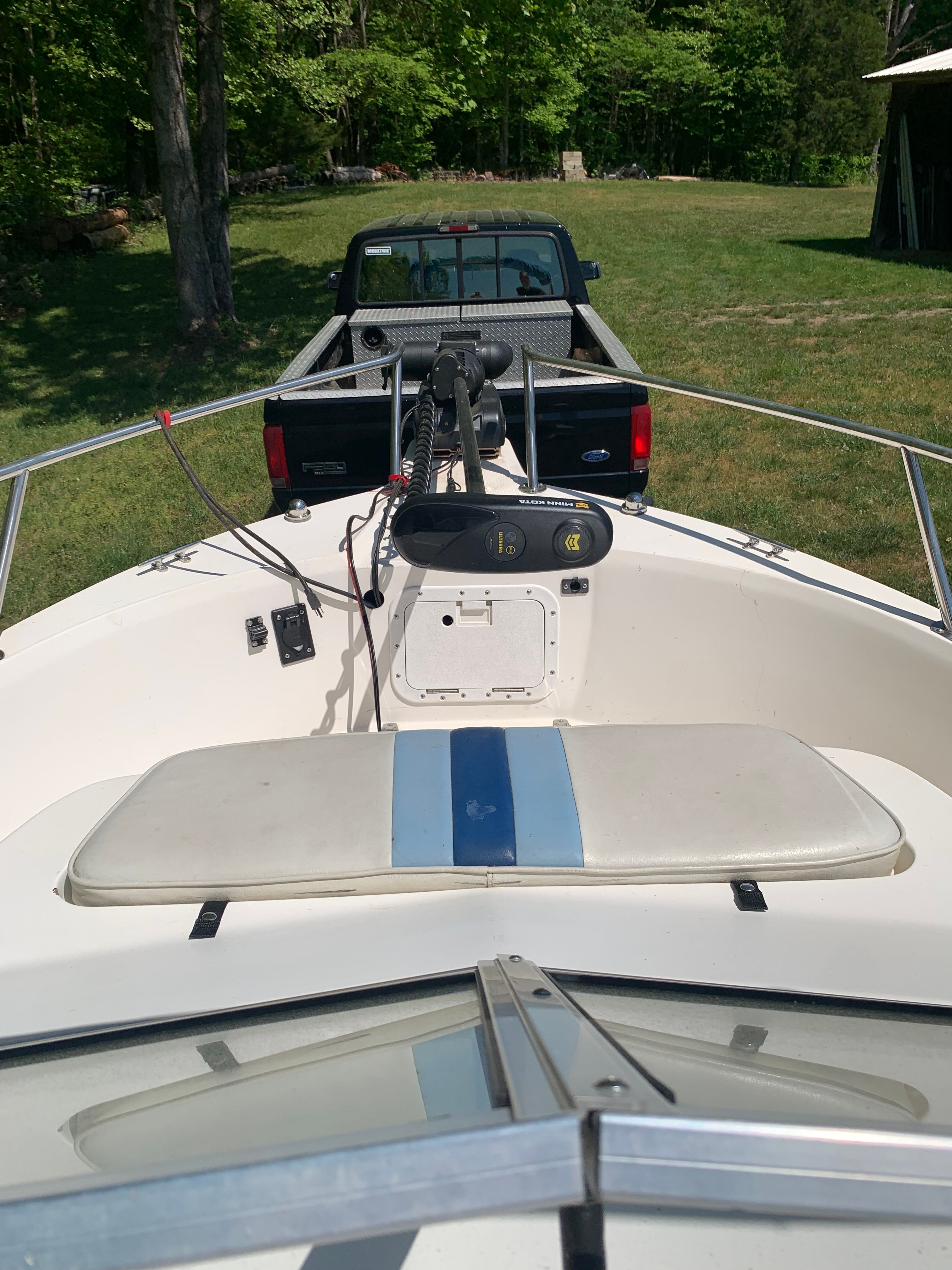 1998 Eurosport 221WA boat on trailer with pickup truck in background.