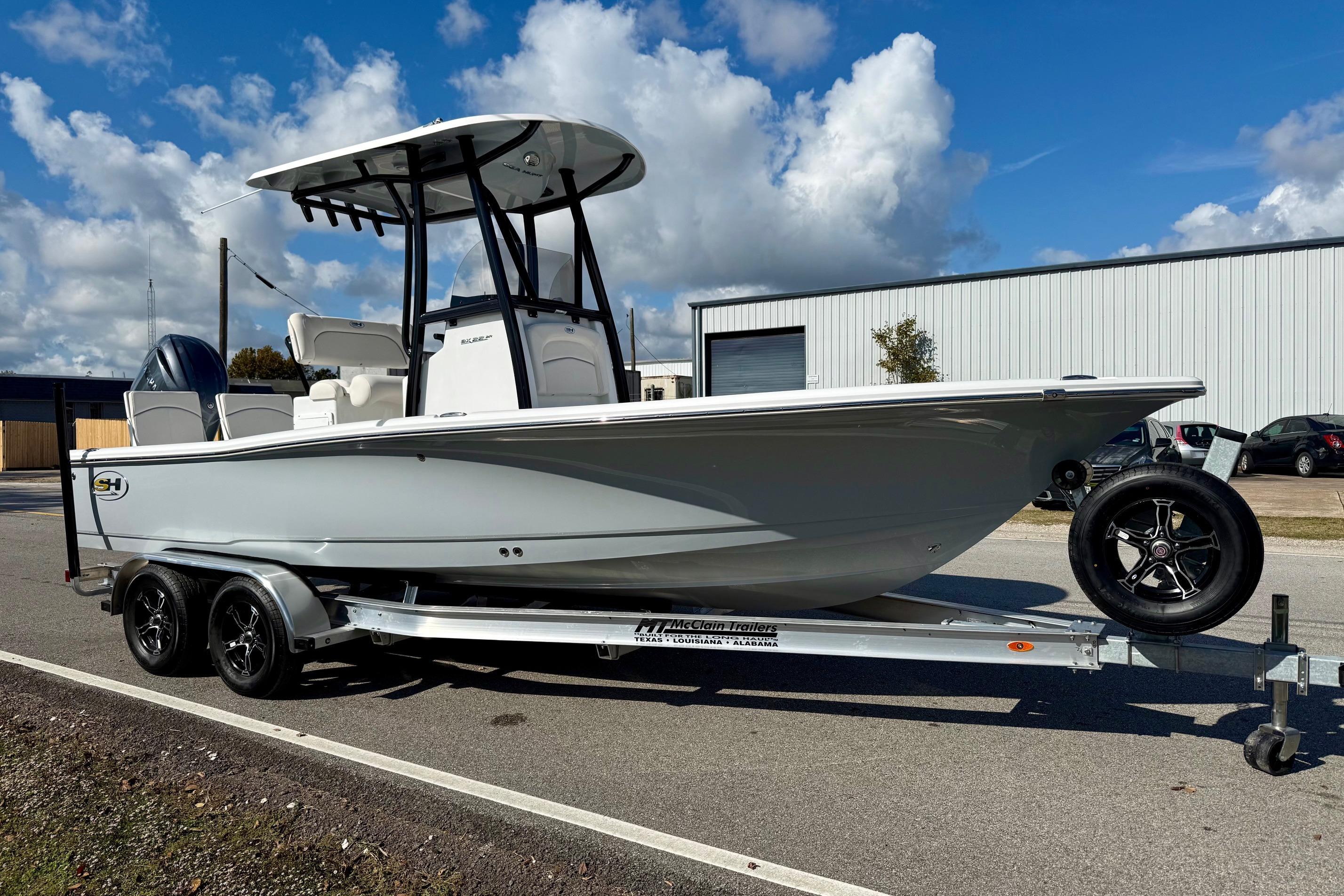 2026 Sea Hunt BX 22 BR boat on trailer under blue sky.