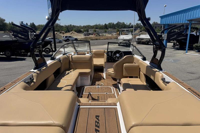 2023 Moomba Mojo Pro boat interior with tan seating and sleek design.