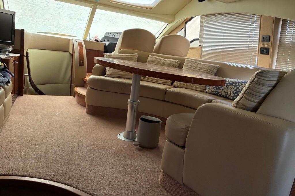 Luxurious interior of a 2008 Sealine T50 yacht with plush seating and elegant decor.
