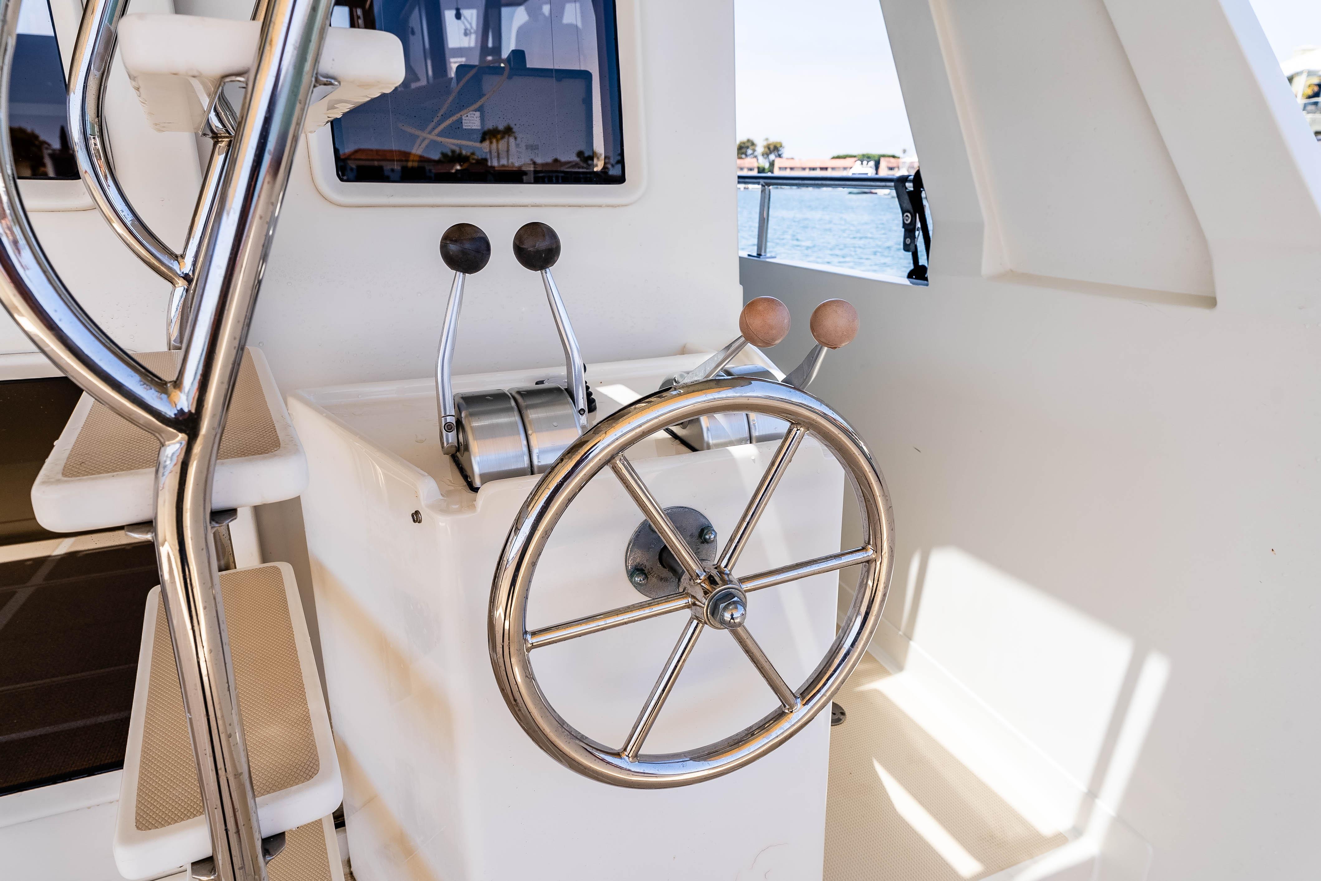 Steering wheel and controls of a 2005 Offshore Yachts 54 Pilothouse.