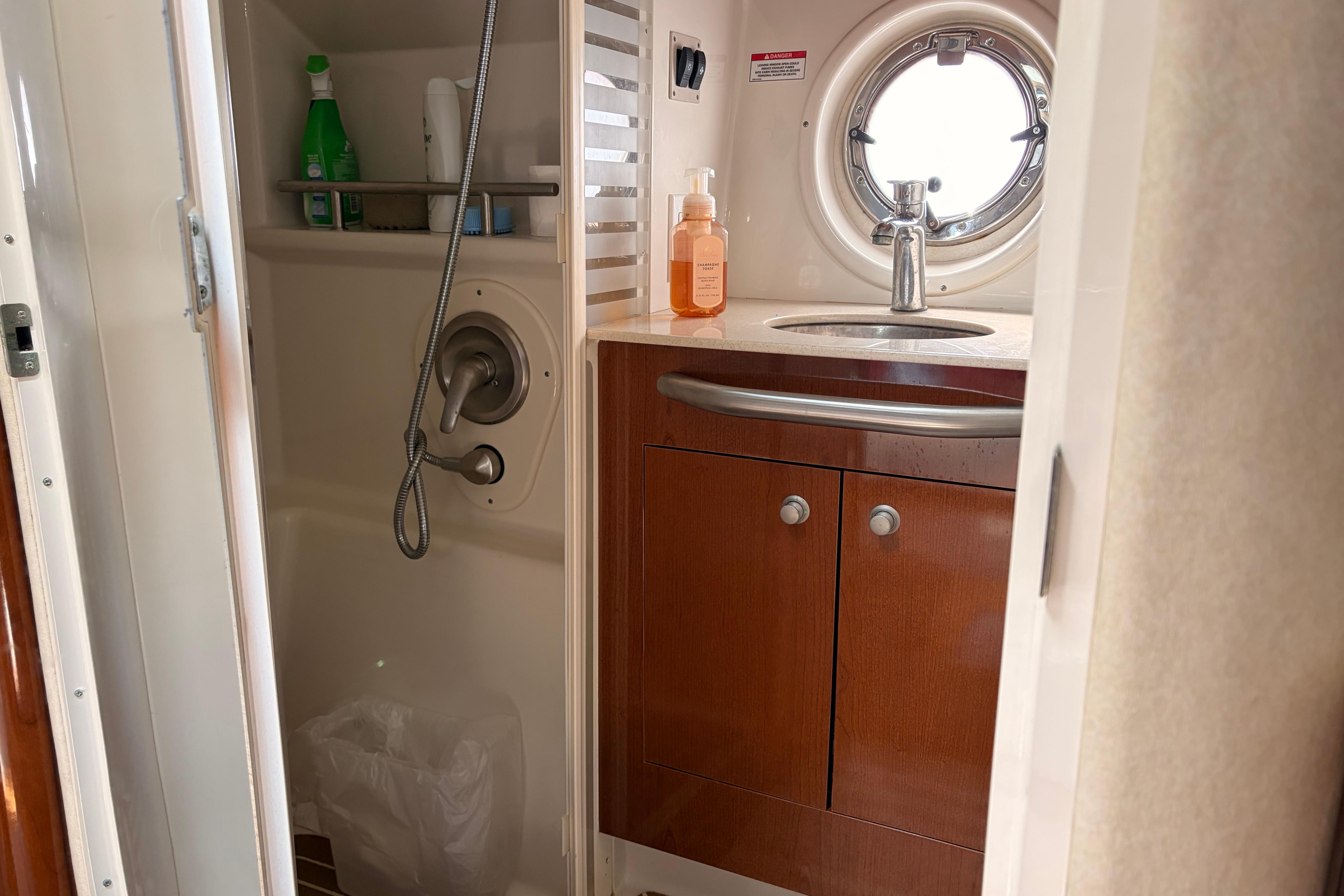 Bathroom interior of 2008 Sea Ray Sundancer 350 yacht with sink and shower.