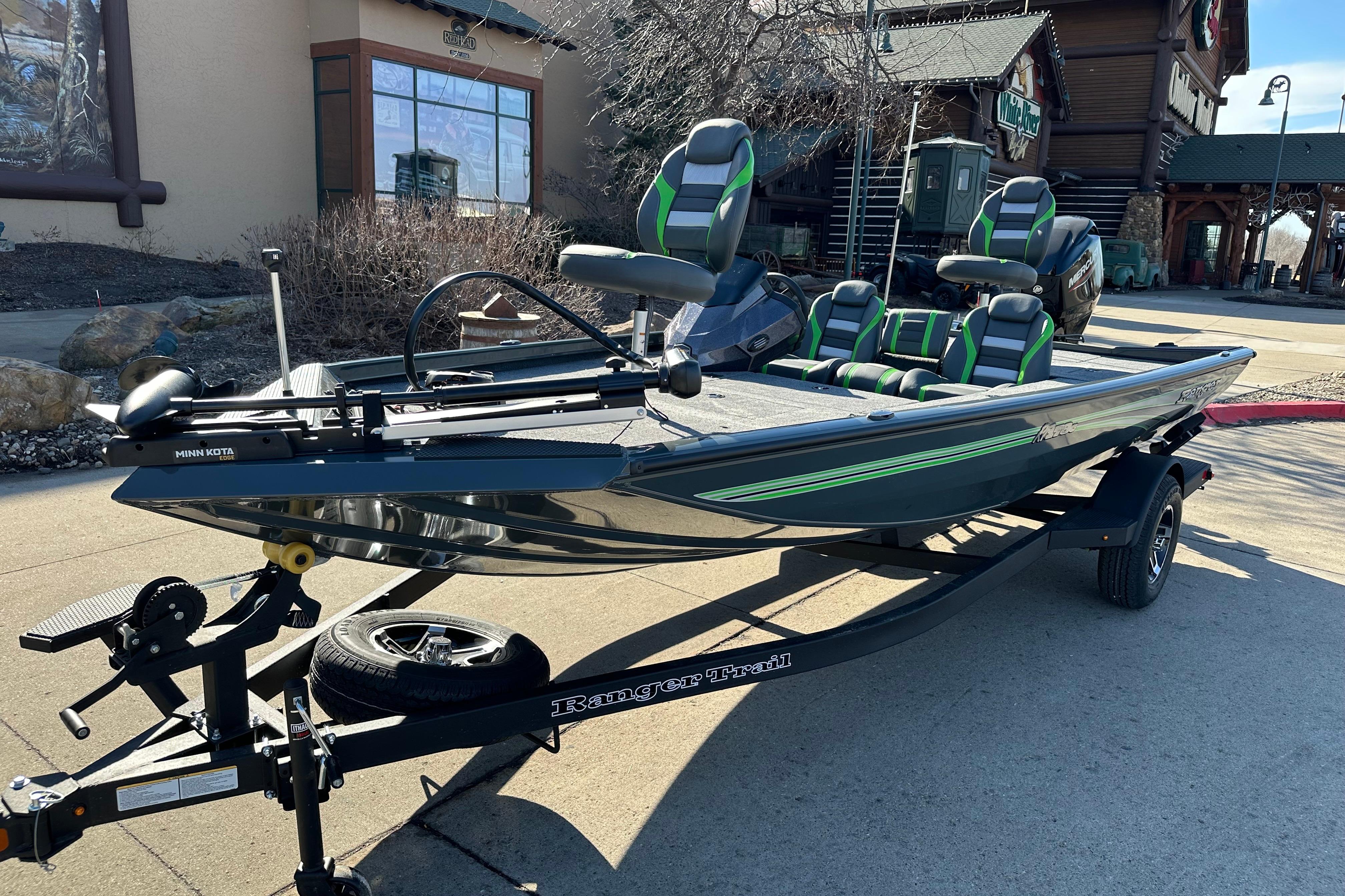 2026 Ranger RT178C fishing boat on trailer, featuring green and black seating.