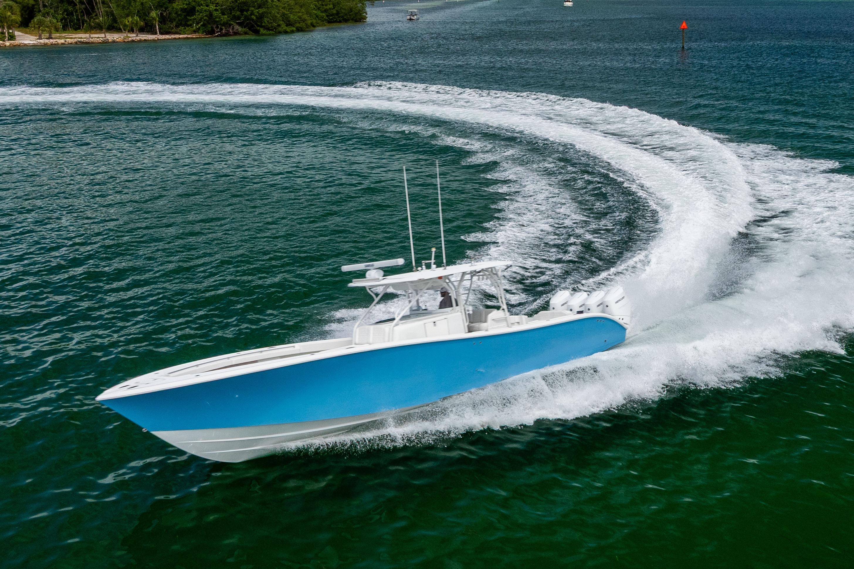 2009 Yellowfin 42 Offshore boat making a sharp turn on open water.