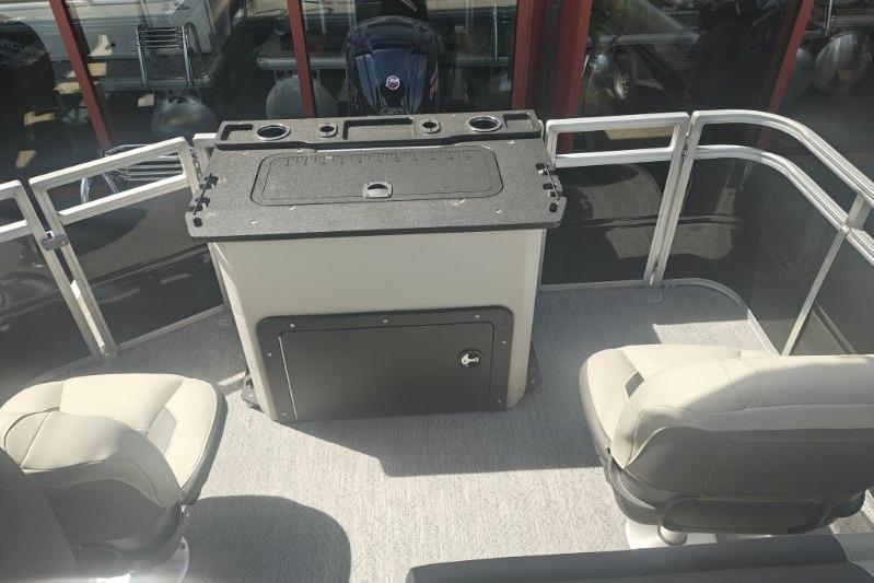 2026 Sun Tracker Fishin' Barge 20 DLX interior with seating and storage.