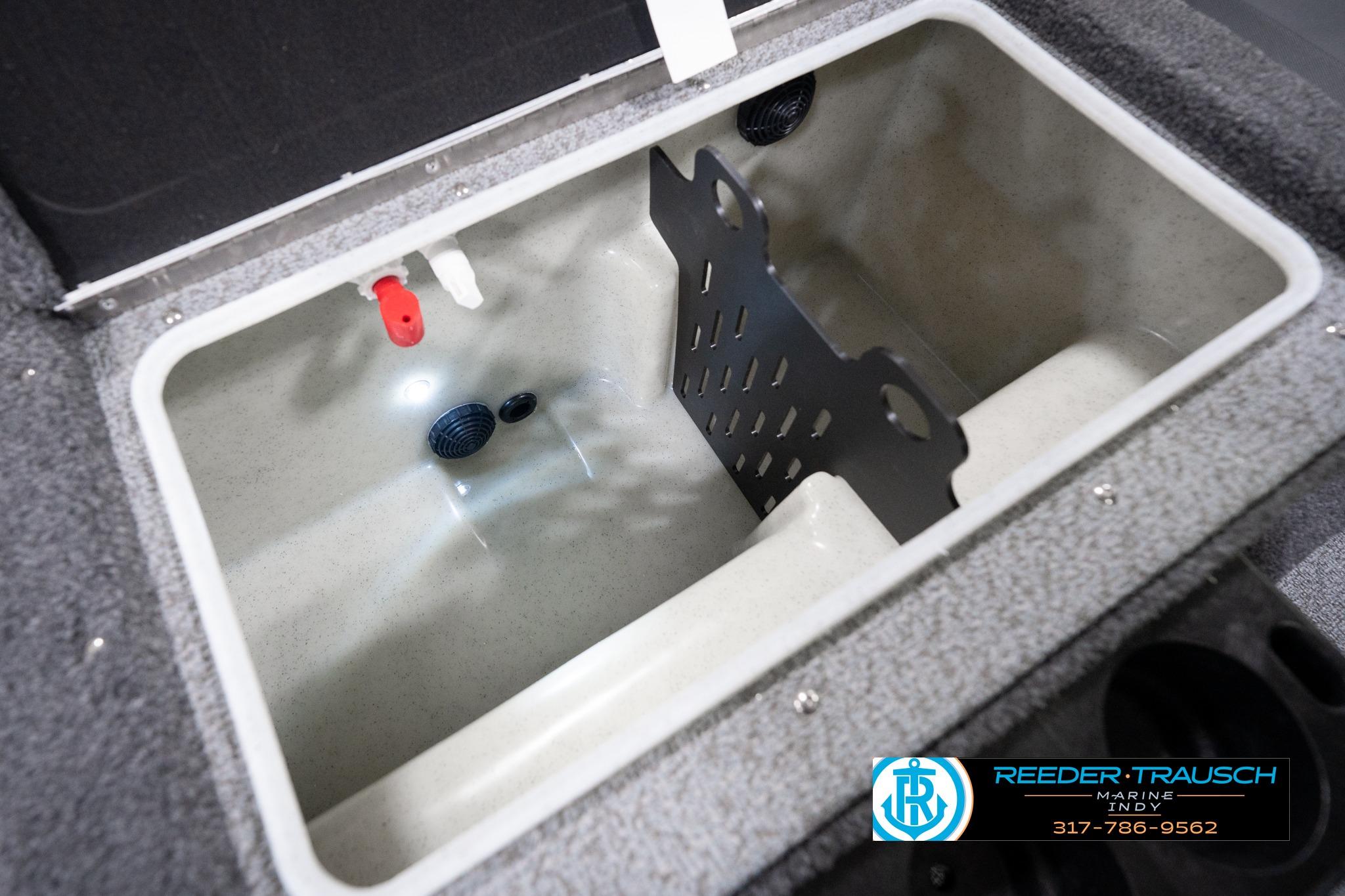 Livewell compartment in 2026 Lund 1775 Impact XS SS boat, featuring drainage and divider.