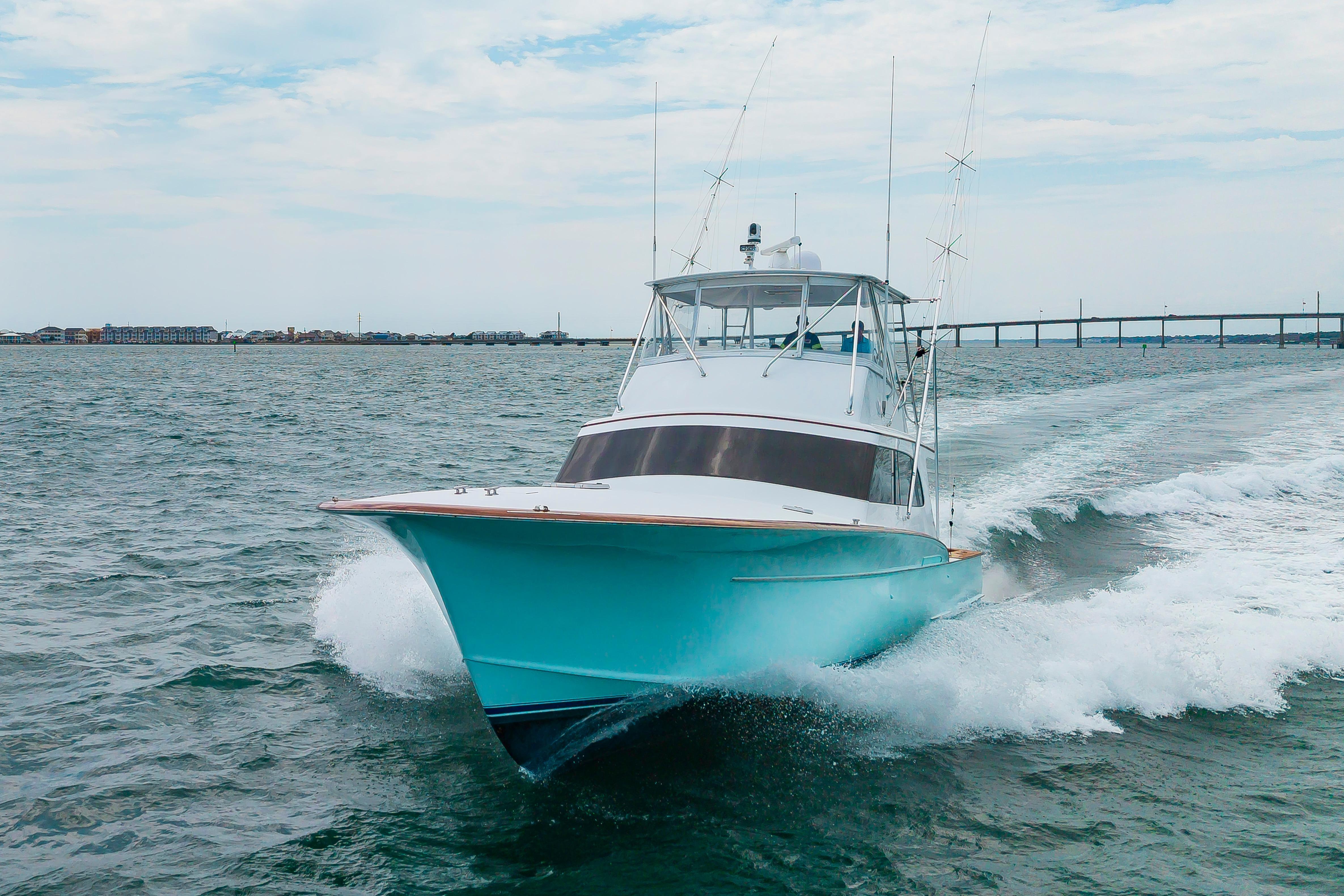 Custom Carolina Scarborough 56 Convertible yacht cruising on open water, 1993 model.