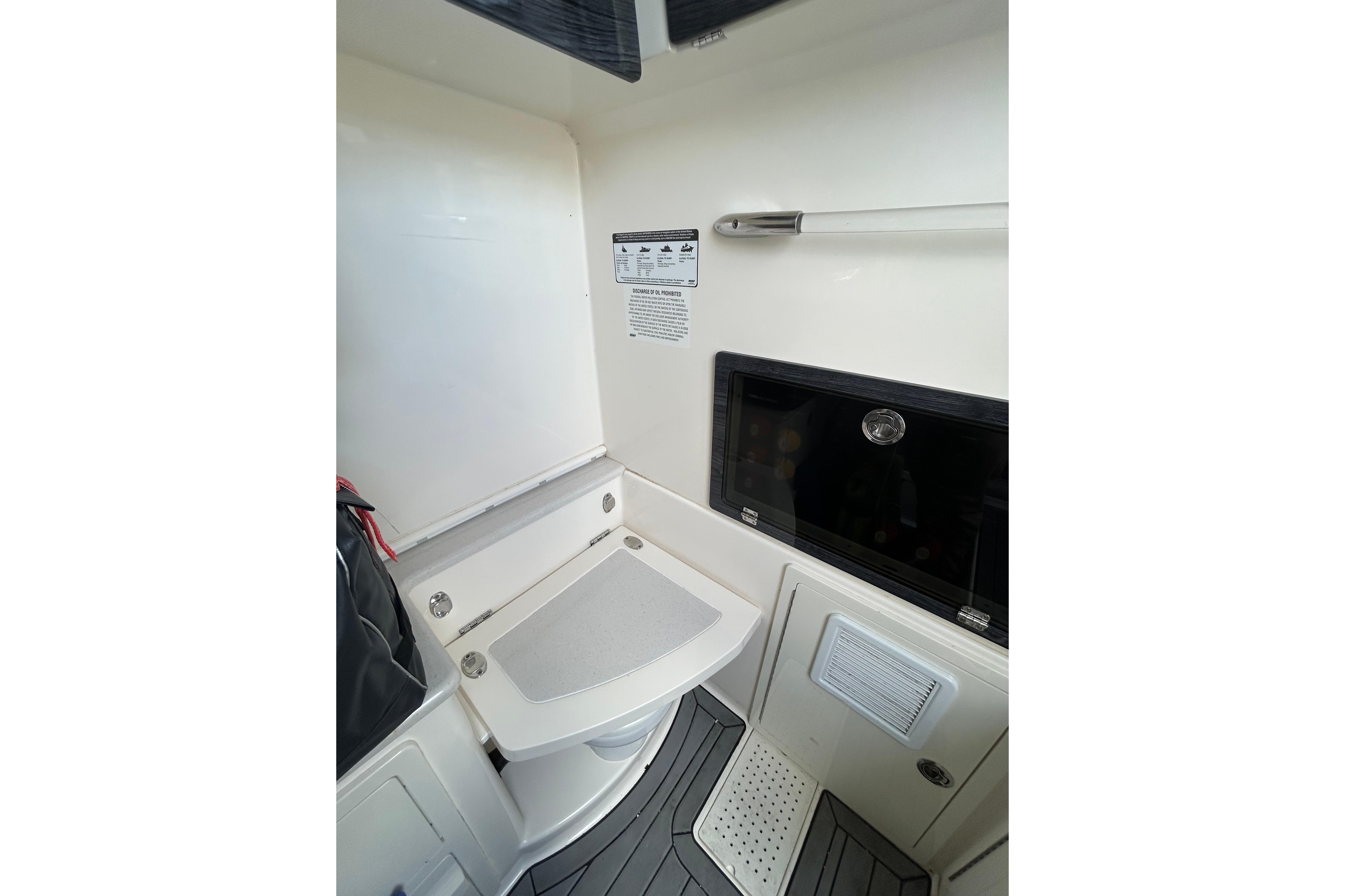 2020 Cobia 350 Center Console interior cabin with seating and storage.