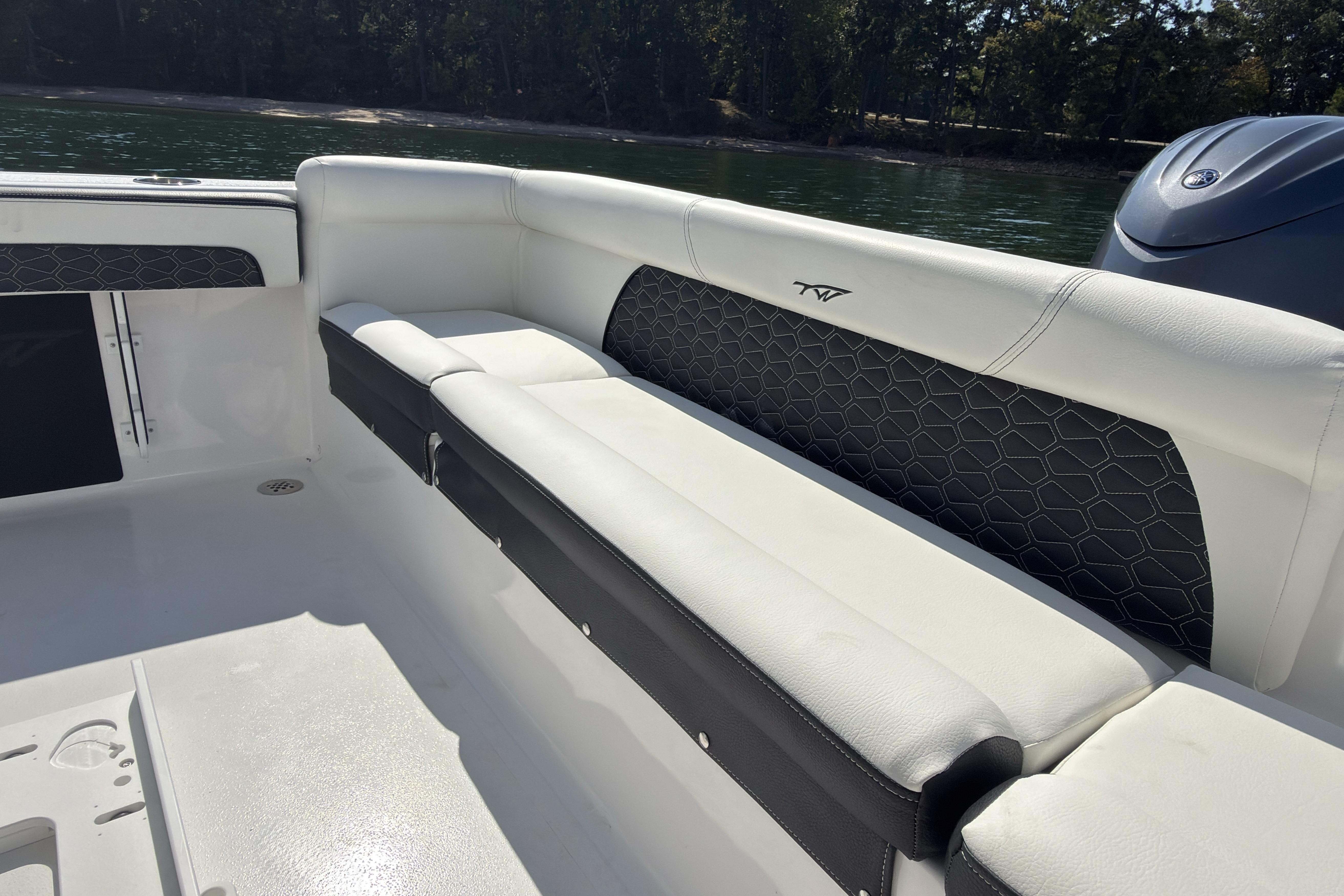2026 Tidewater 220 LXF boat interior with cushioned seating and sleek design.