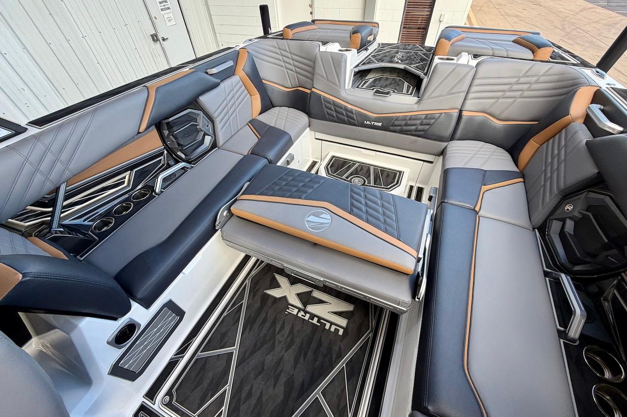 Luxurious interior of 2025 Tigé Ultré 25ZX boat with stylish seating and modern design.
