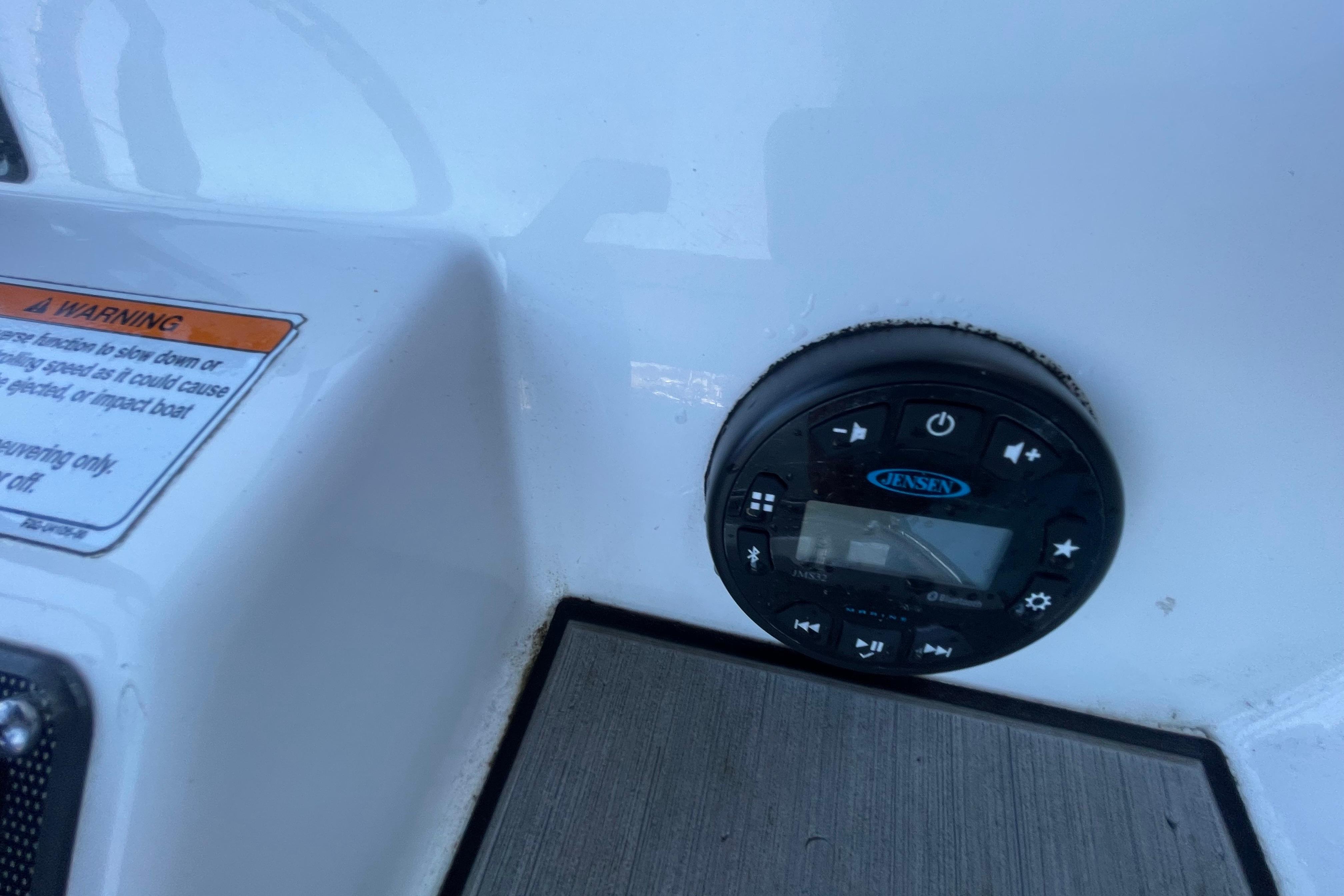 Control panel on 2021 Yamaha Boats 195 FSH Sport, featuring Jensen audio system.