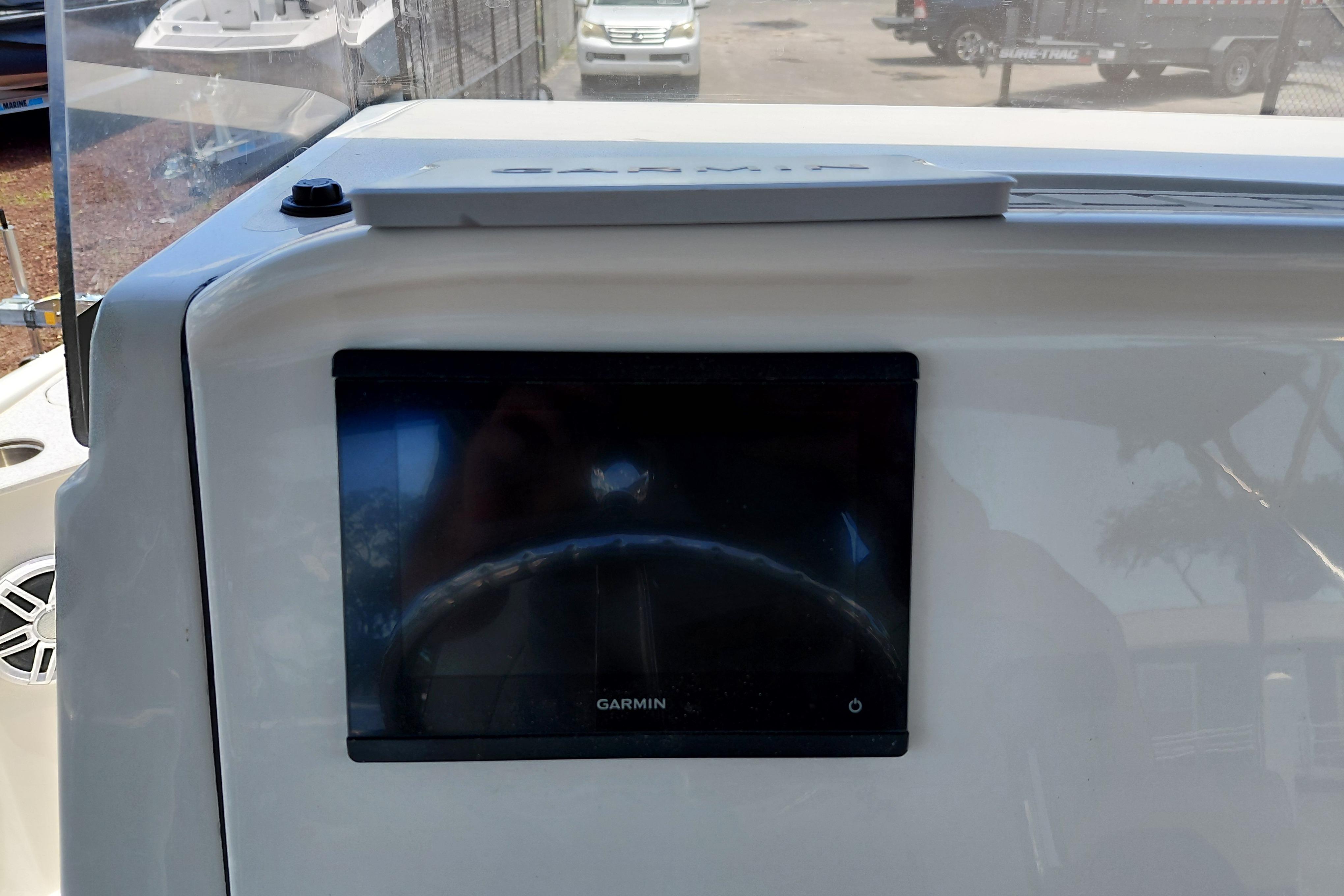 2023 Stingray 206 CC boat dashboard with Garmin navigation display.