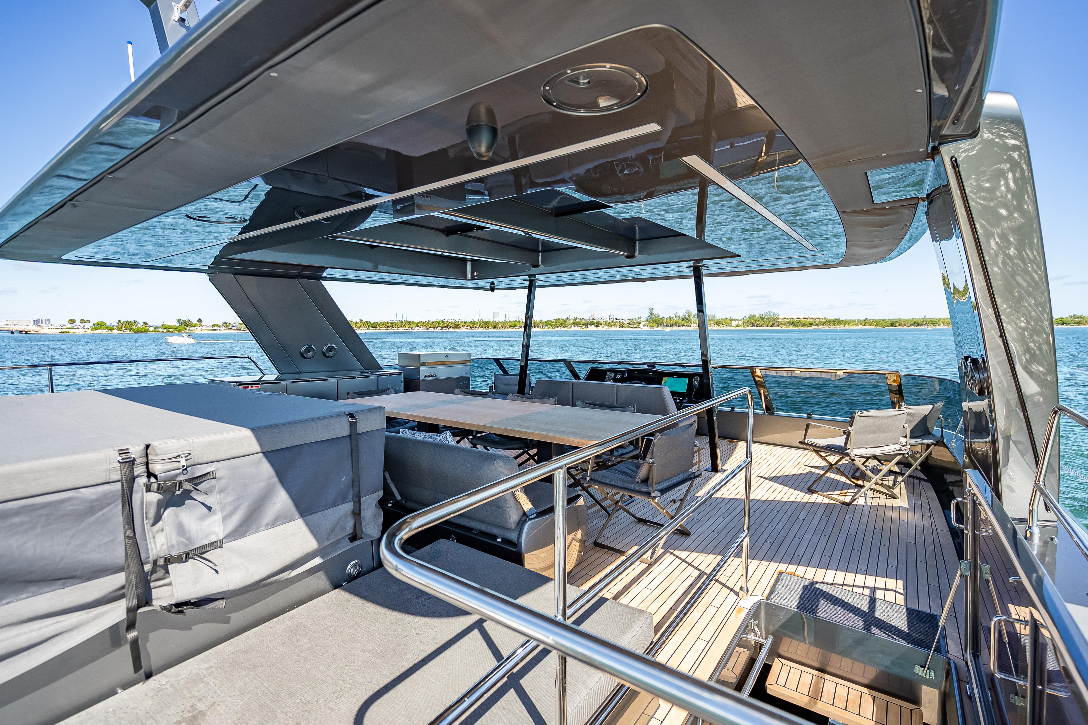 Luxurious Sunreef 60 Power yacht deck, 2026 model, featuring elegant seating and ocean views.