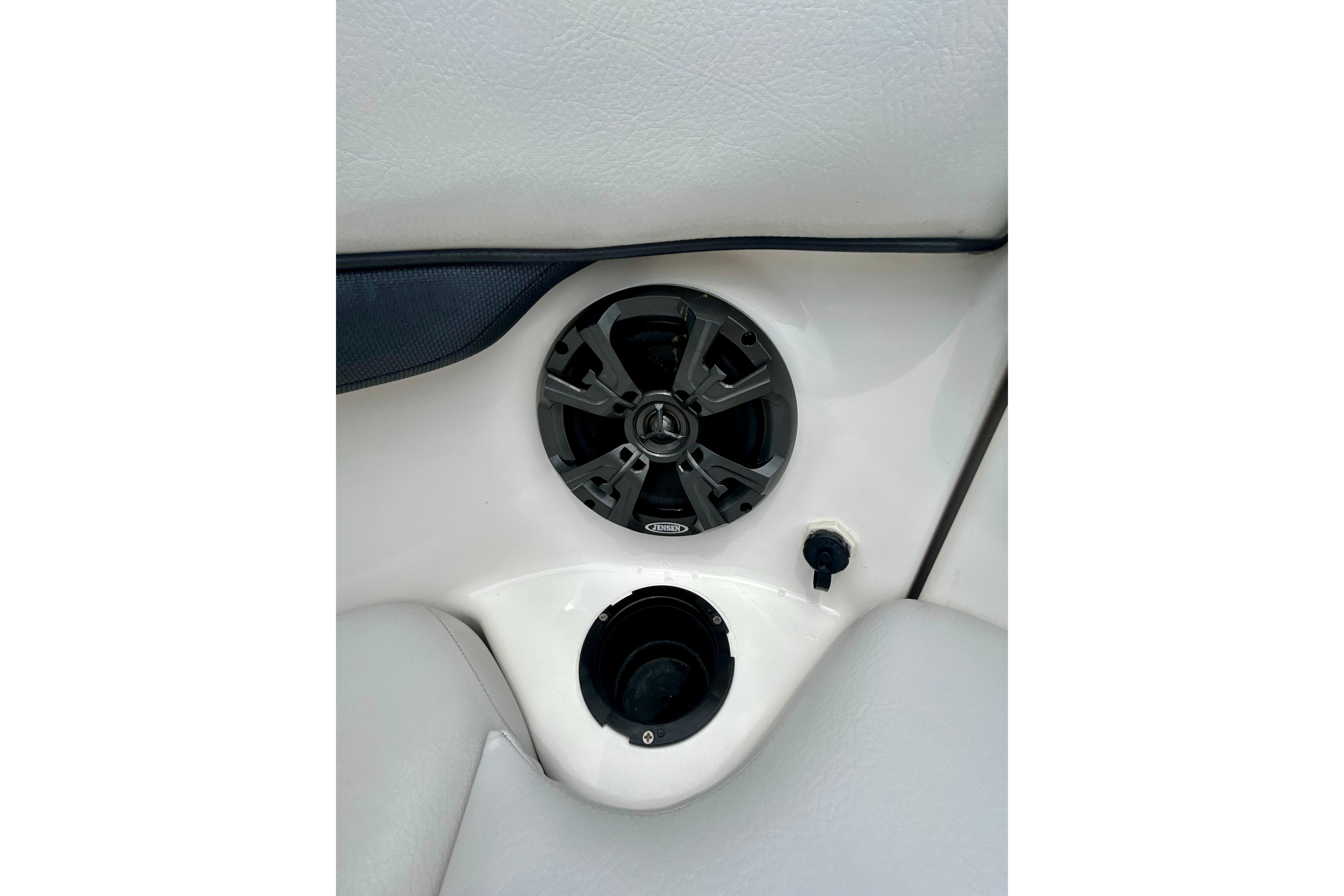 Speaker and cup holder on 2015 Yamaha AR210 boat interior.