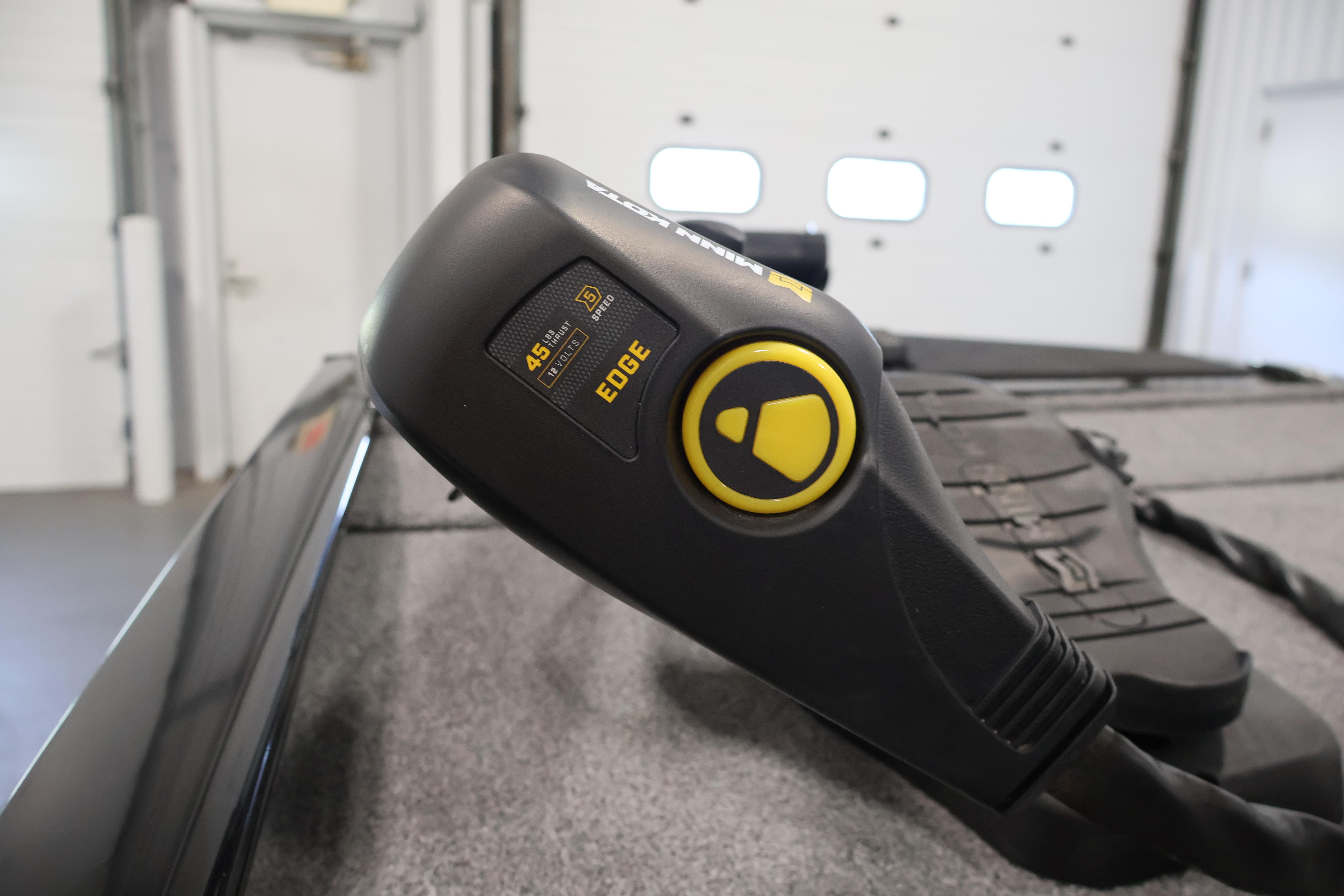 Close-up of a 2024 Tracker Pro 170 boat control panel indoors.