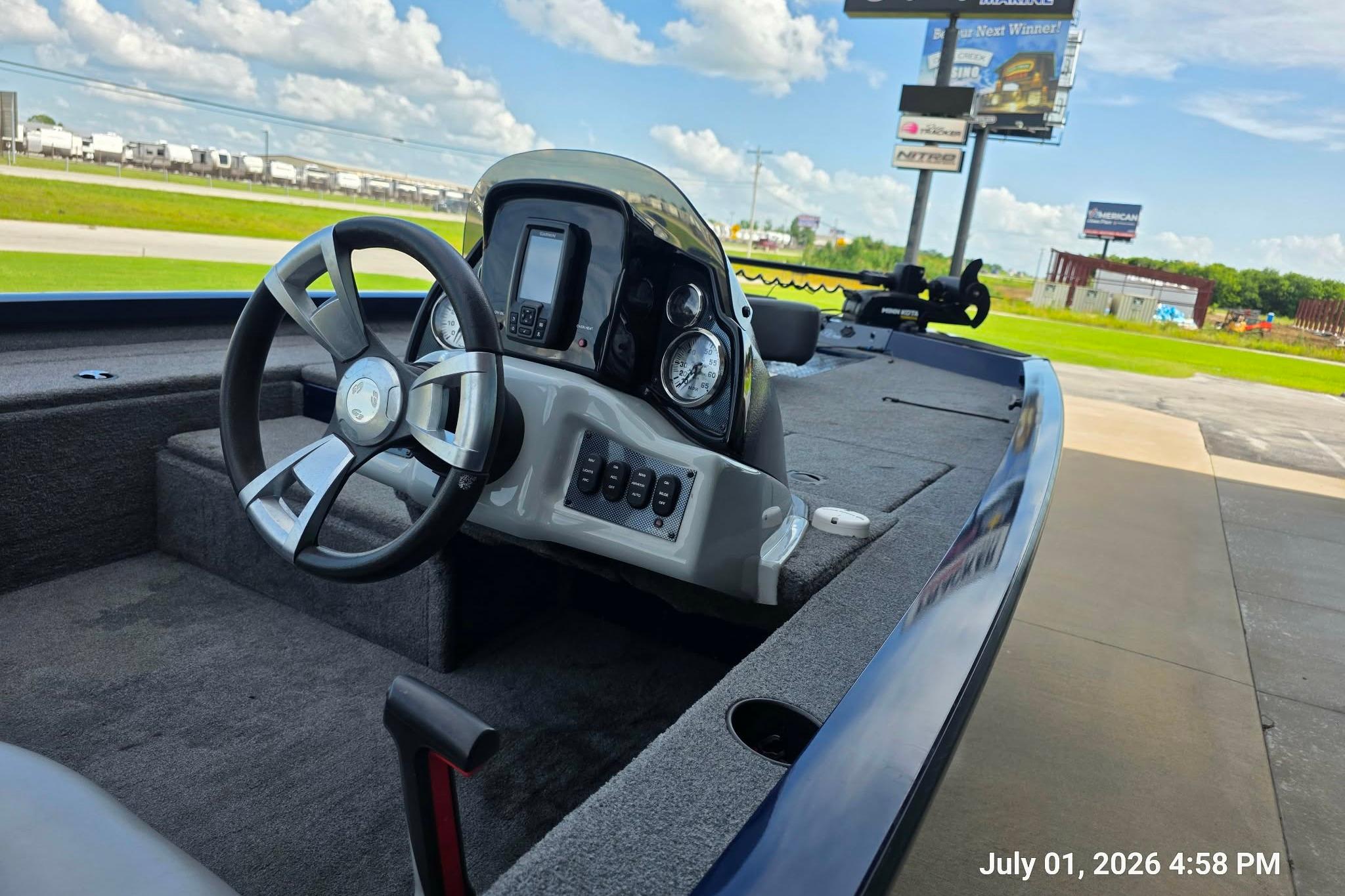 2017 G3 Sportsman 18 boat dashboard with steering wheel and controls, outdoors.