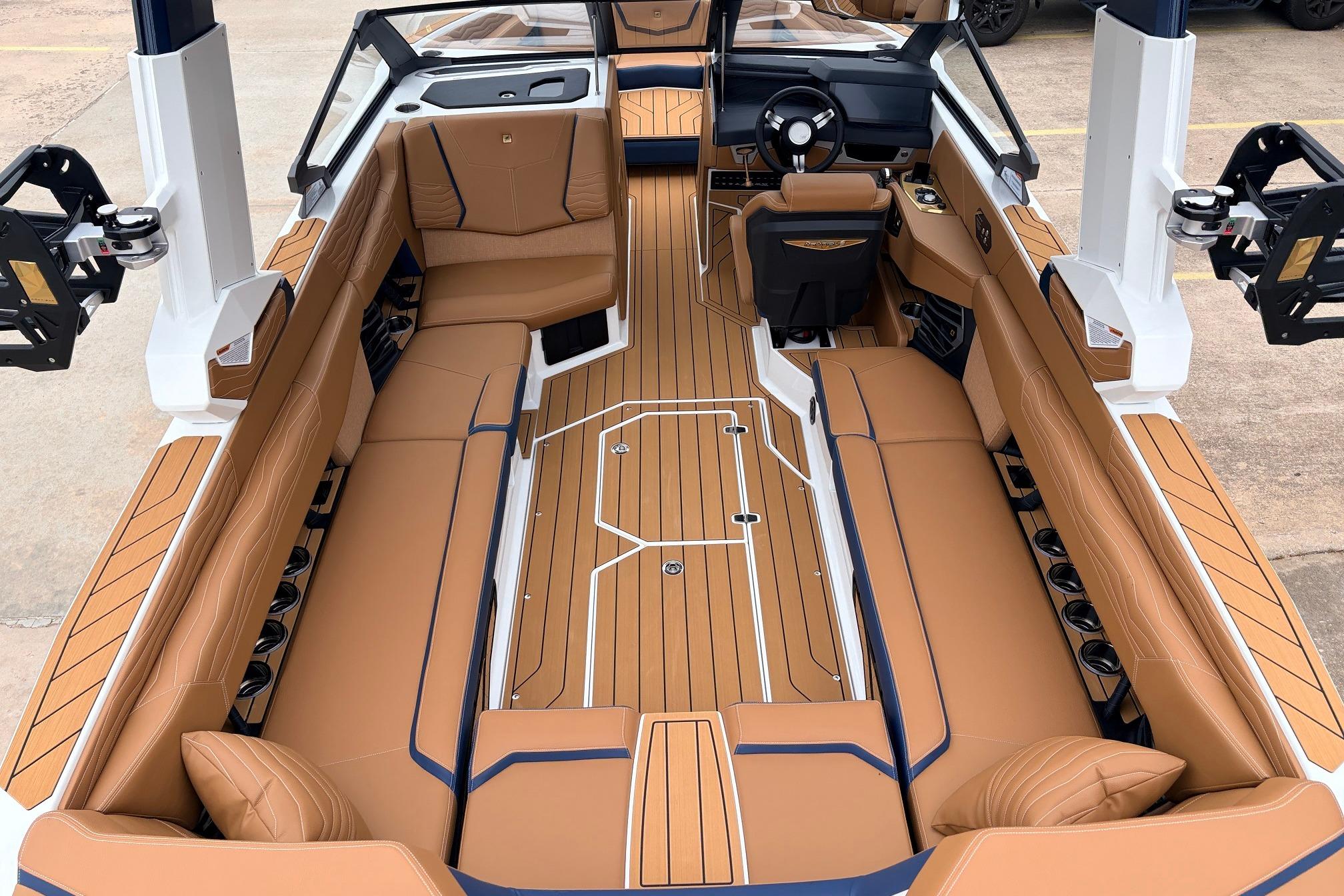 2026 Nautique Super Air Nautique G25 interior with luxurious tan seating and sleek design.