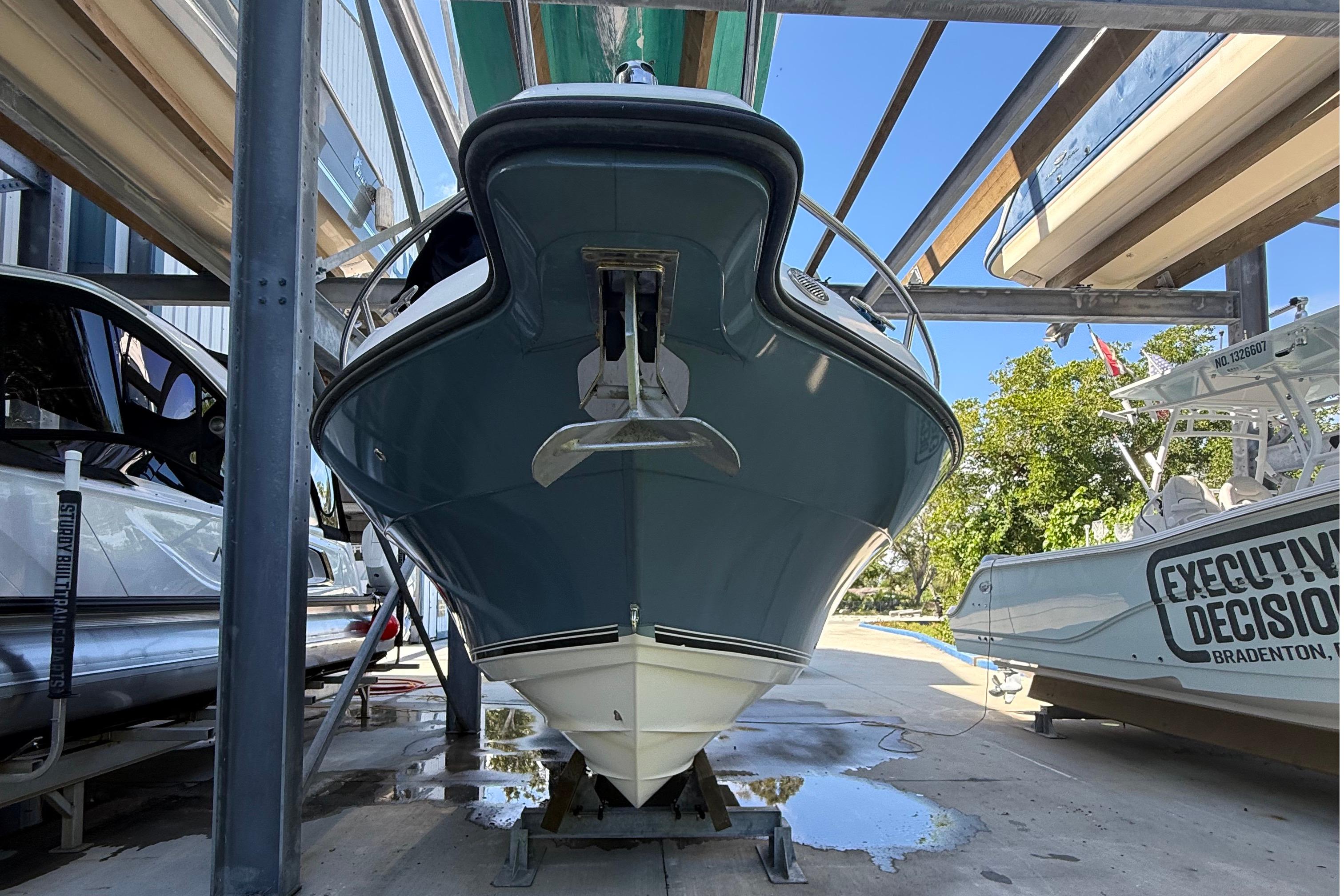 2008 Century 2901 Center Console boat in storage, viewed from the front.