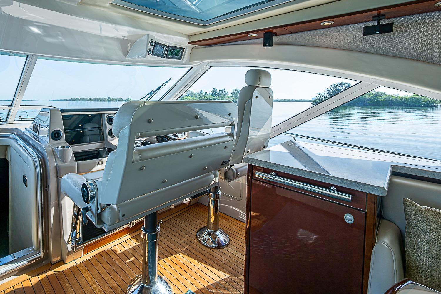 Interior of a 2008 Sea Ray 60 Sundancer yacht with helm and seating area.