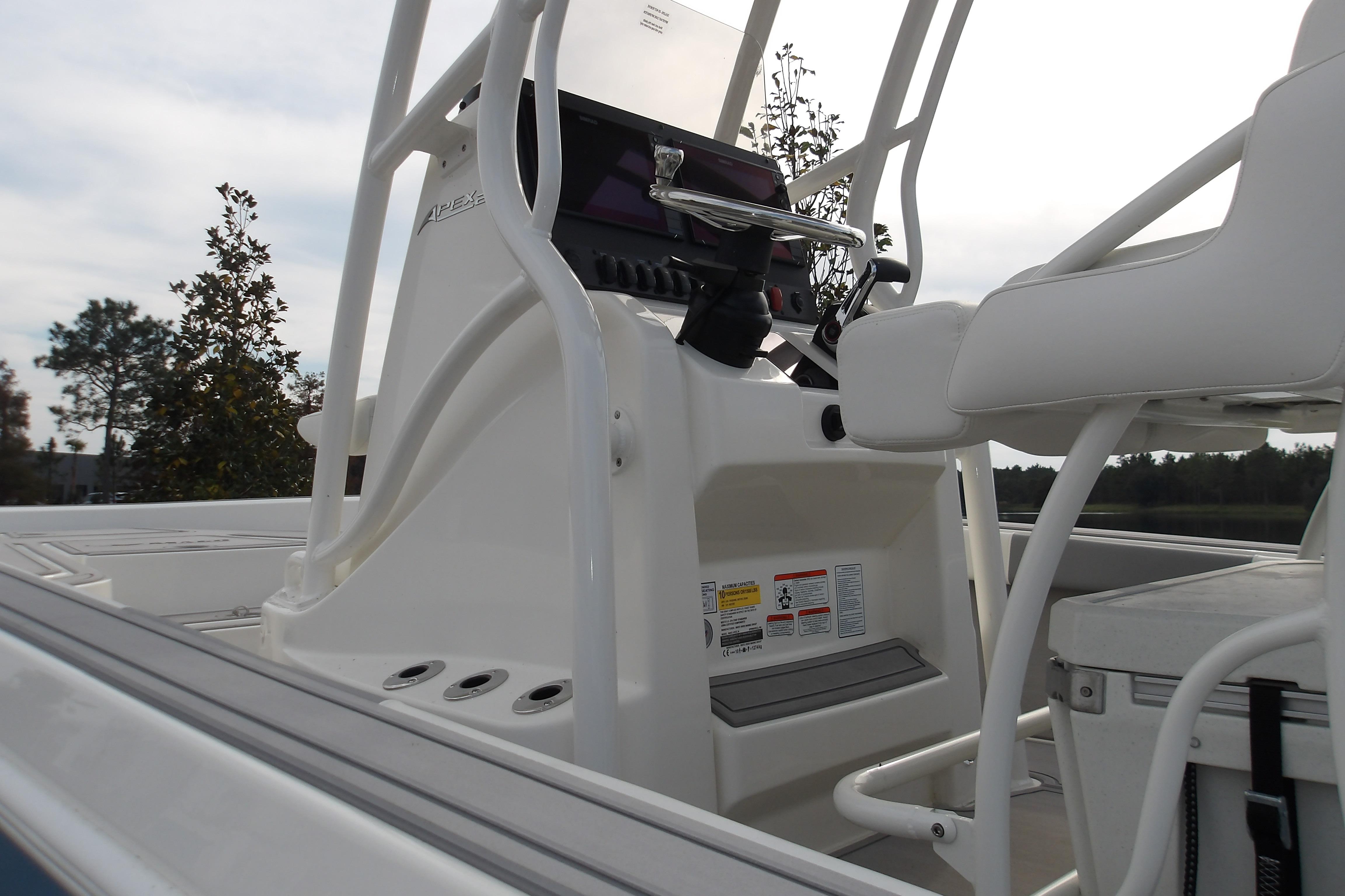 2026 Mako 24 APEX boat console with white seating and control panel.