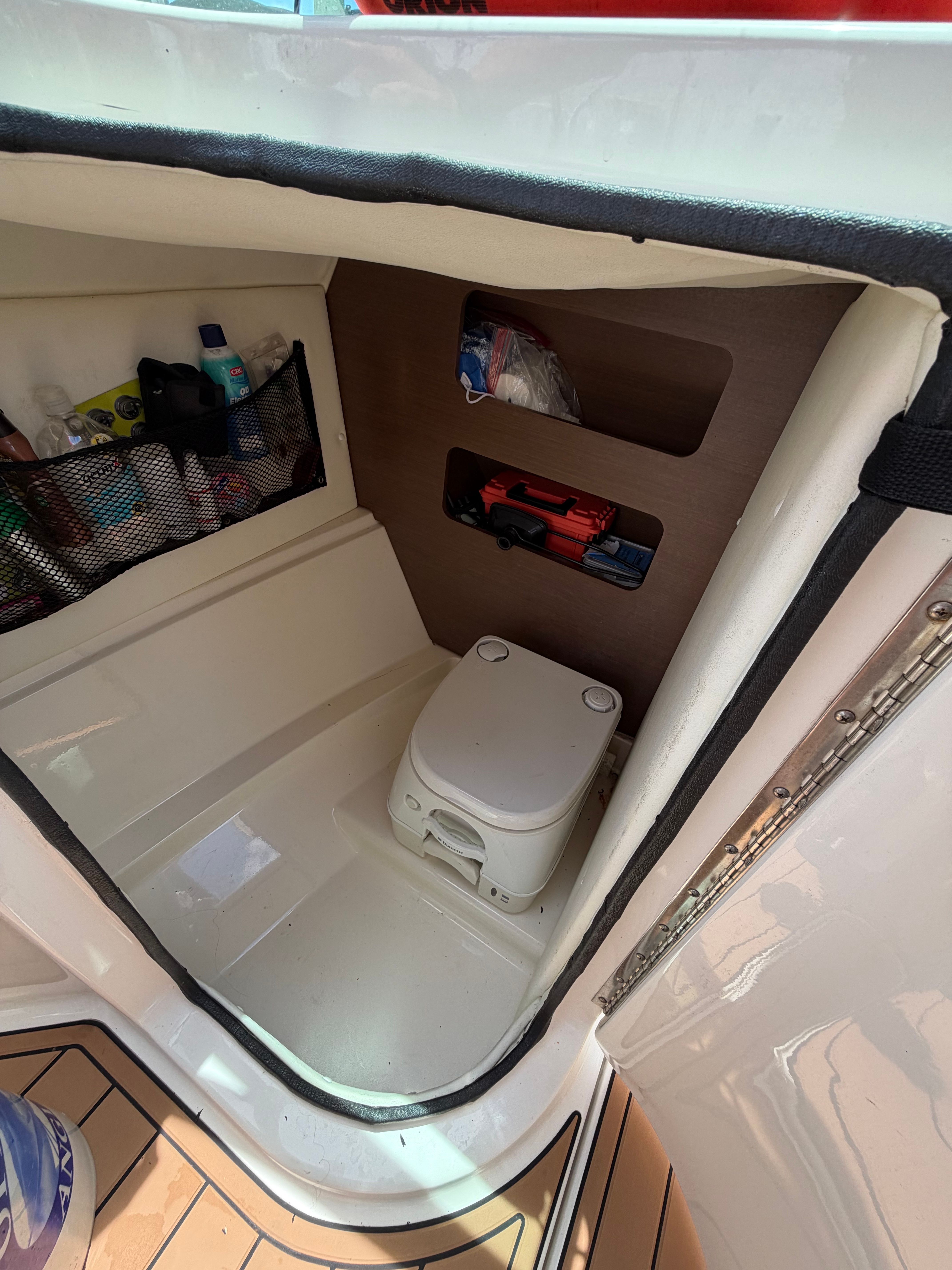 Interior of a 2015 Sea Ray 240 Sundeck with toilet.
