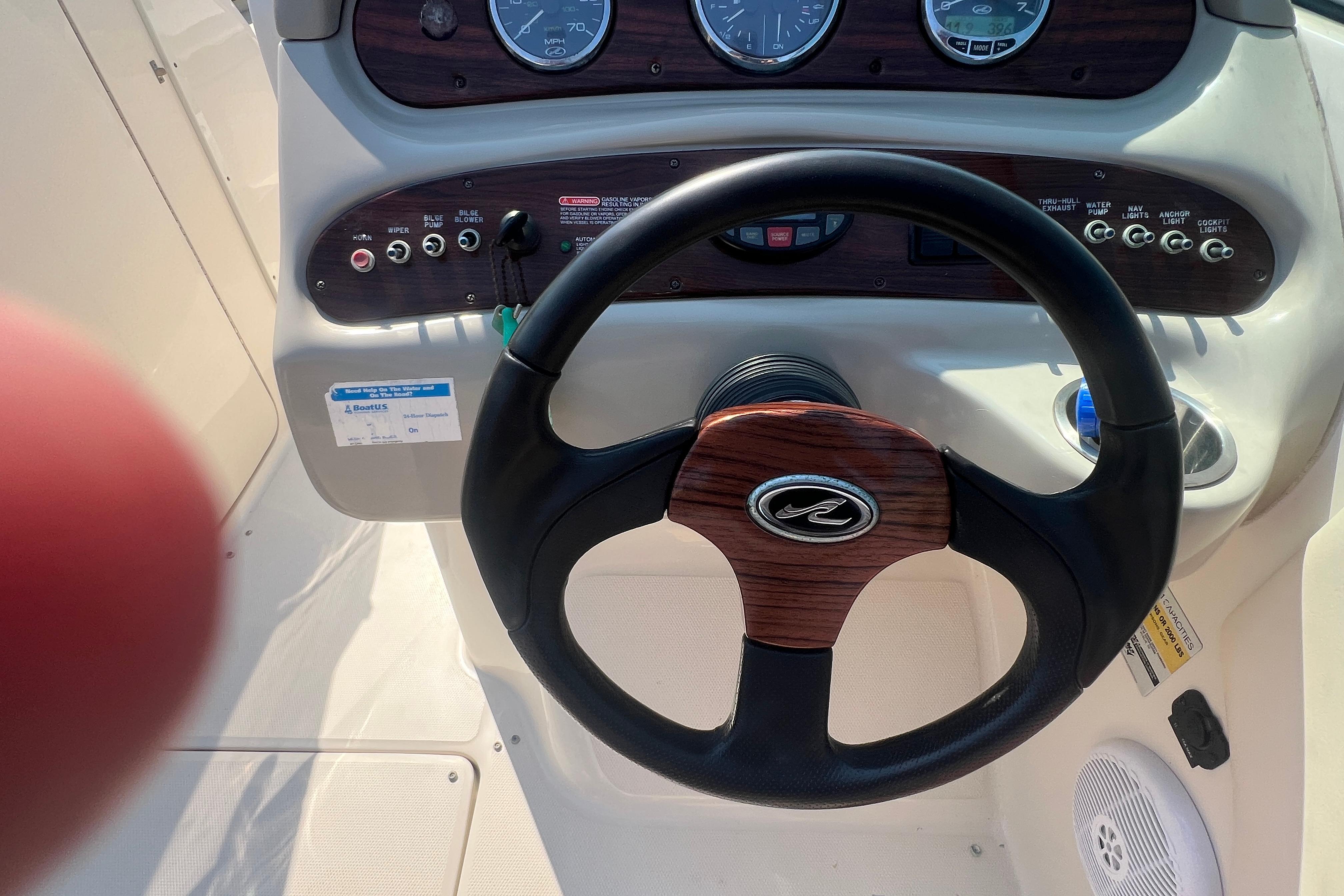 Steering wheel and dashboard of a 2005 Sea Ray 240 Sundeck boat.