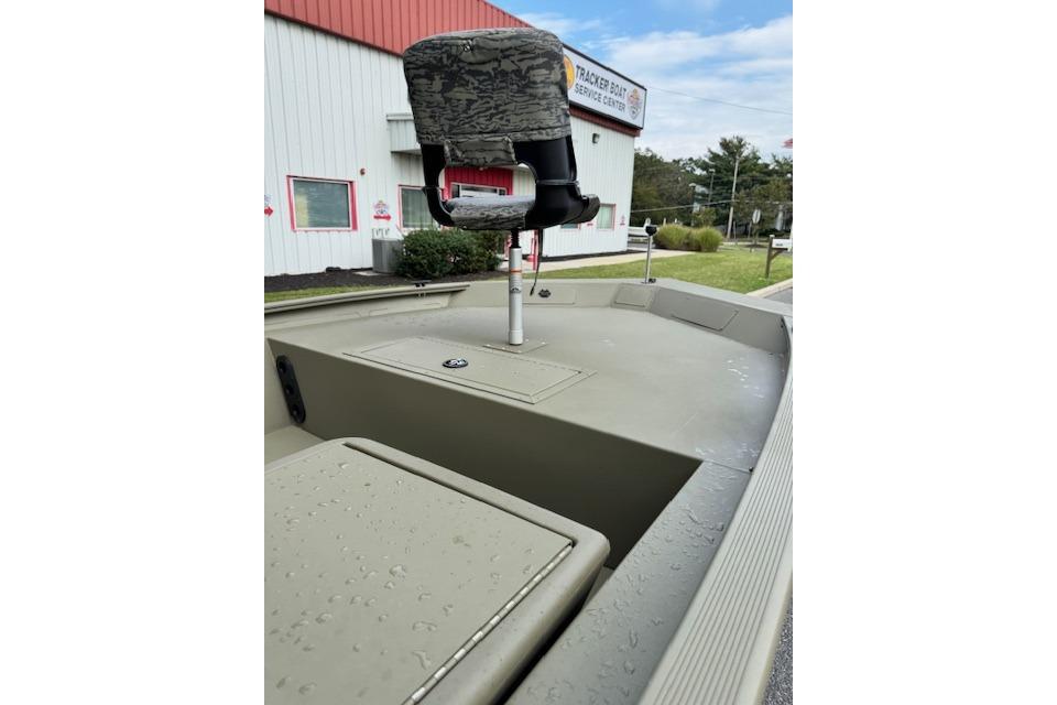 2026 Tracker Grizzly 1754 SC boat with camo seat at service center.