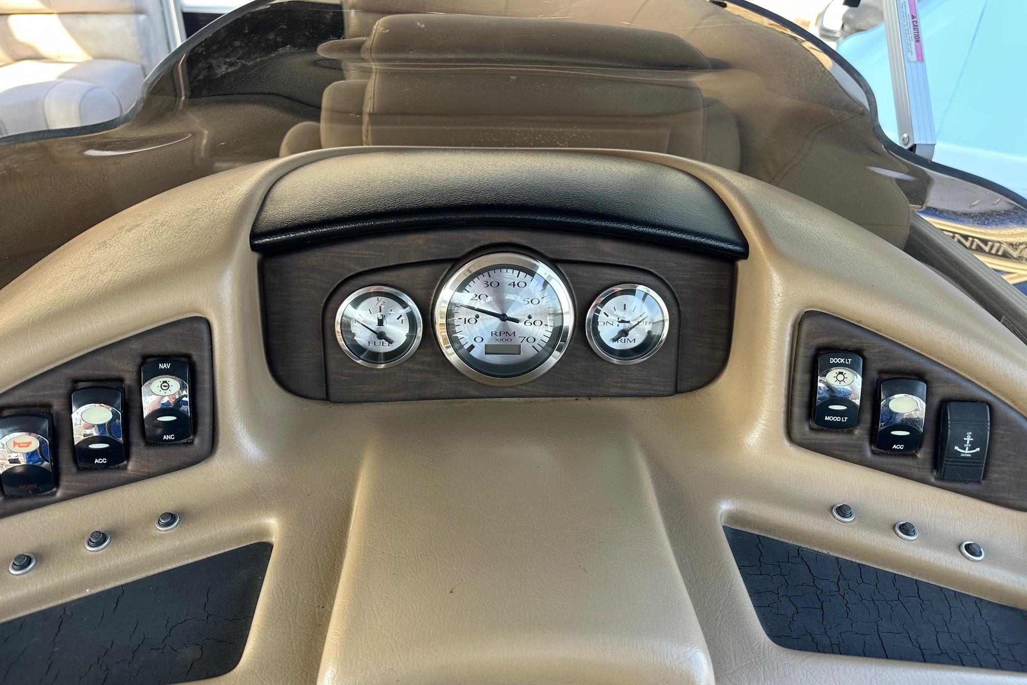 Dashboard of a 2017 Bennington 22 GPD boat with gauges and controls.