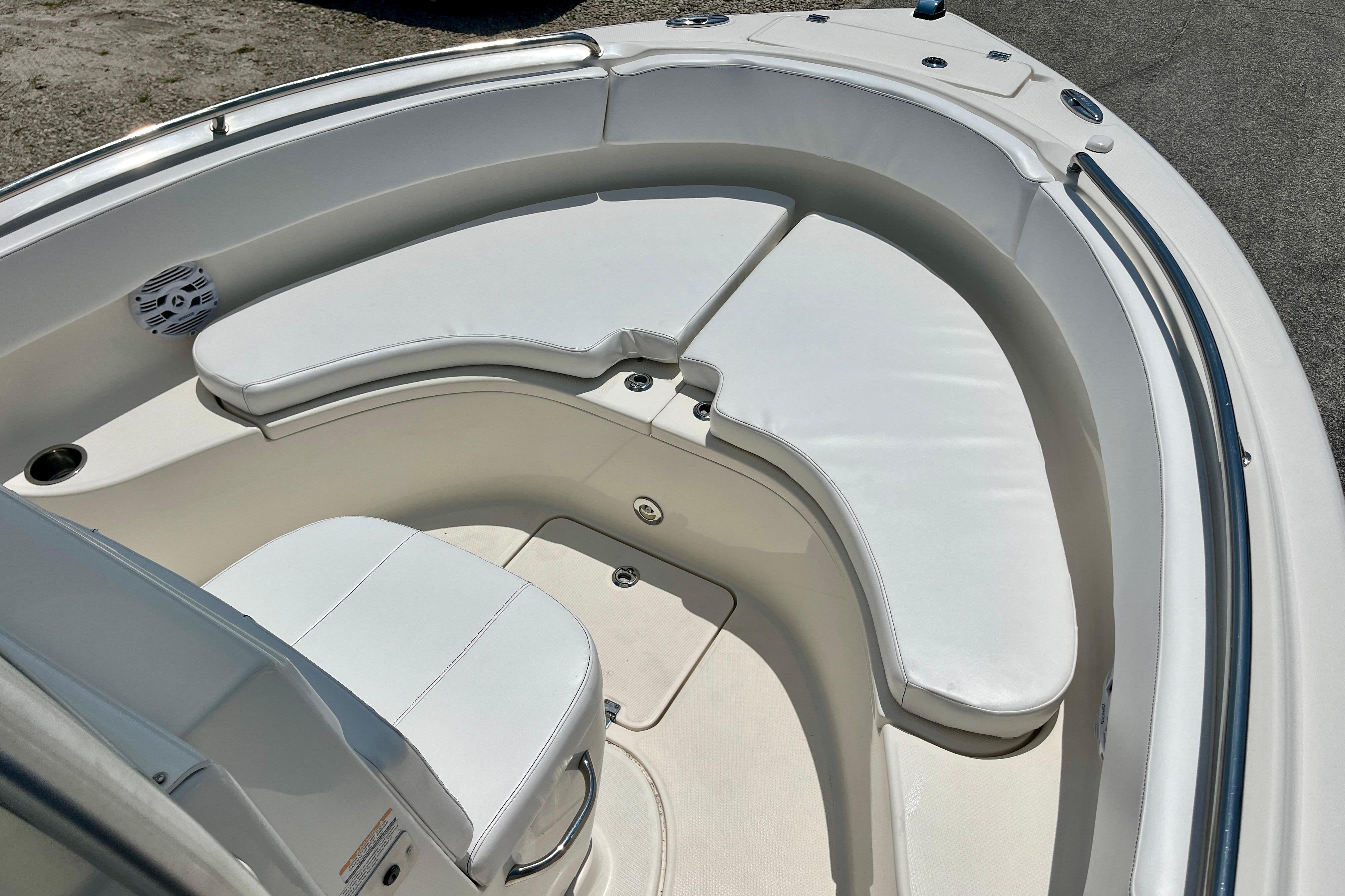2016 Robalo R222 Center Console boat with cushioned seating area.