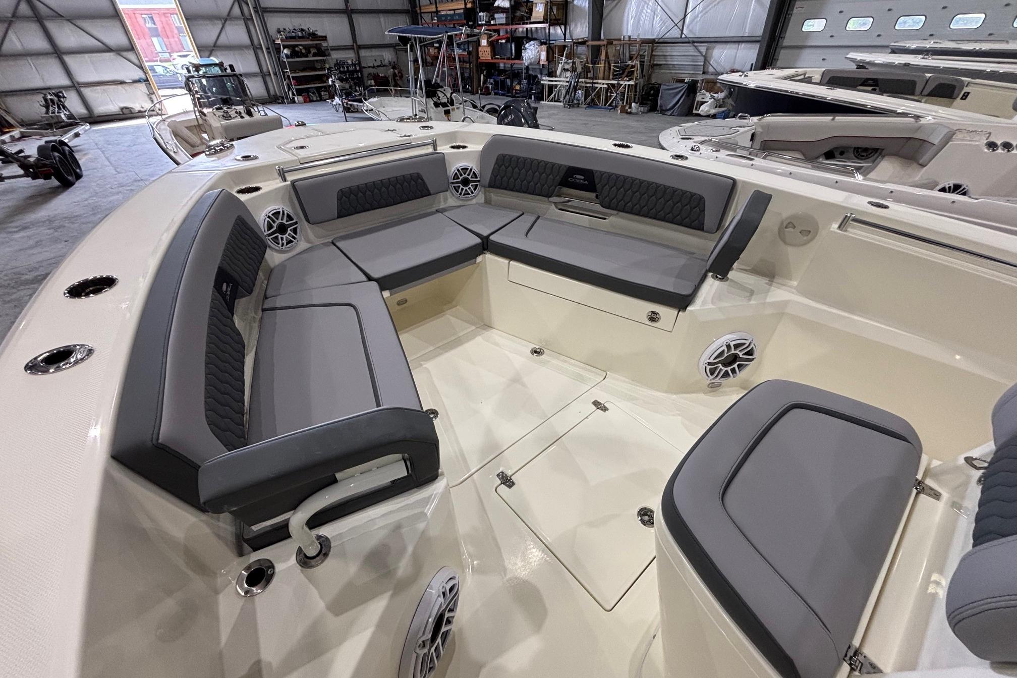 2026 Cobia 285 Open Center Console boat interior with cushioned seating in a spacious layout.
