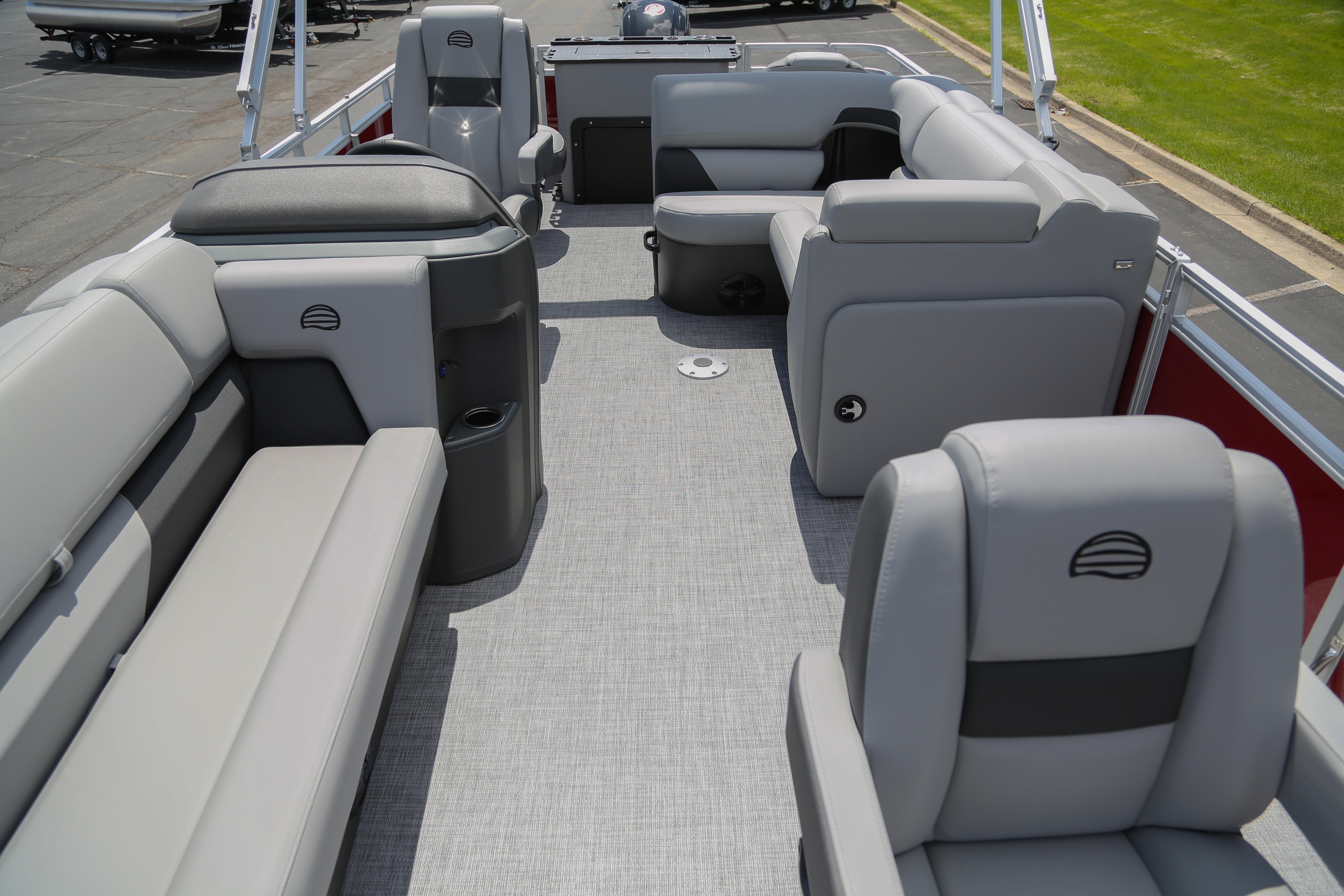 2026 Sun Tracker SportFish 20 DLX pontoon boat interior with gray seating and spacious layout.